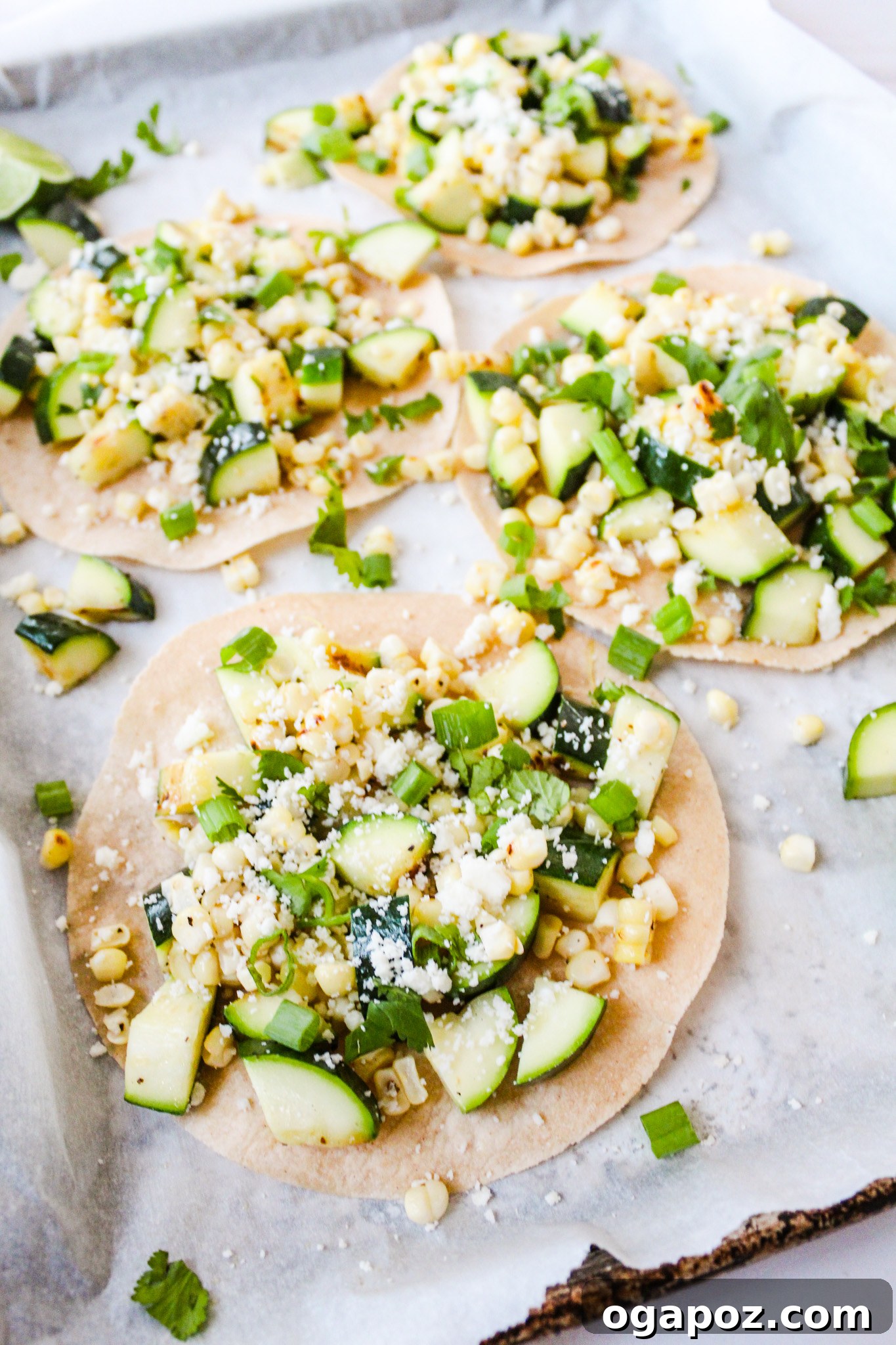 Effortless Zucchini Tacos 7 Multiple Easy Zucchini Tacos arranged on a baking sheet, garnished and ready to serve.