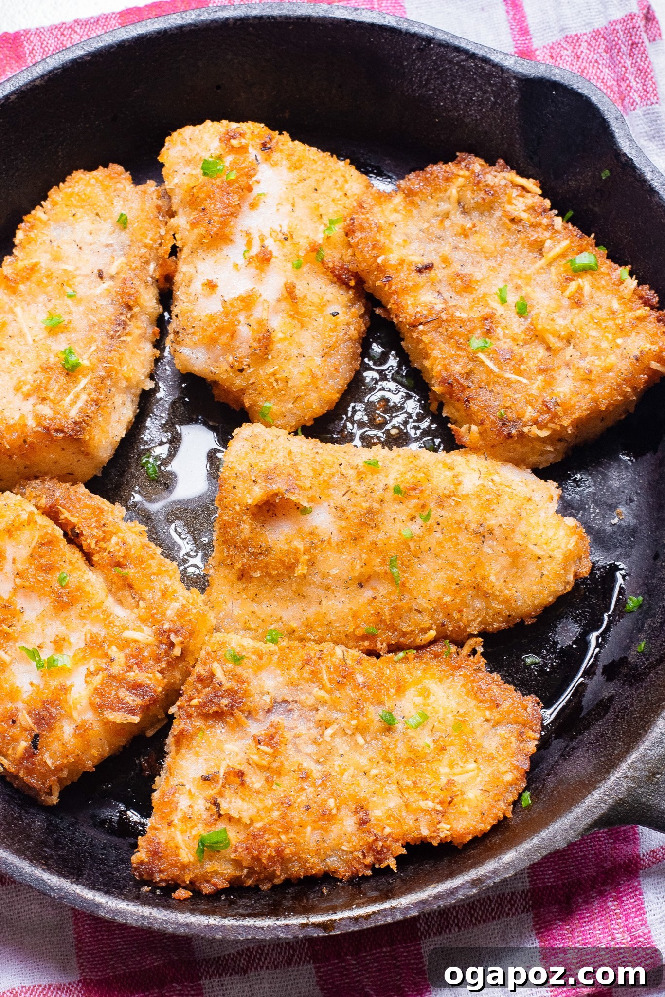 One-Pan Fish Perfection 7 Easy Pan-Fried Fish cooking in a hot skillet, showing a beautiful golden-brown crust.