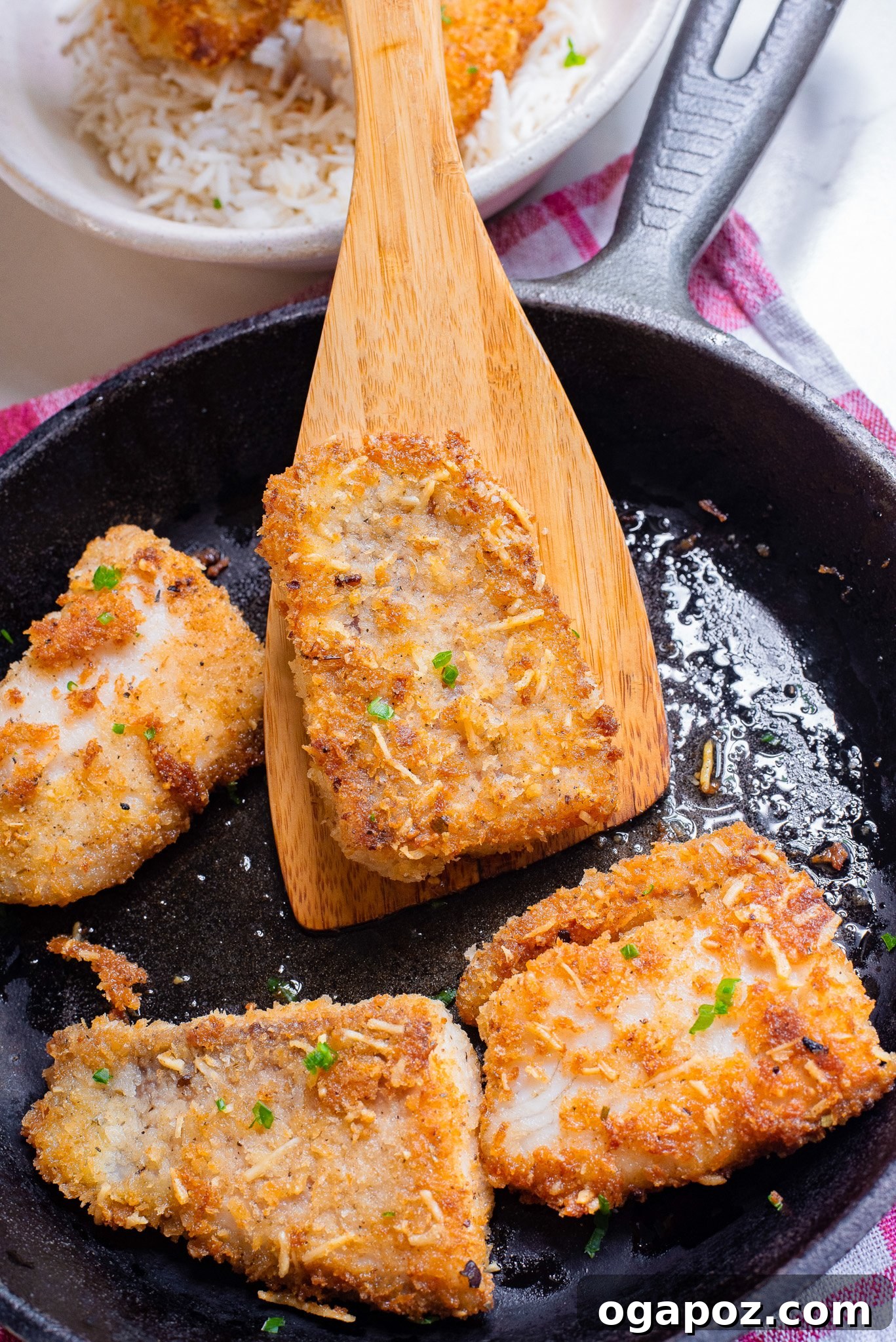 One-Pan Fish Perfection 8 Two pieces of Easy Pan-Fried Fish in a hot skillet, cooking to perfection.