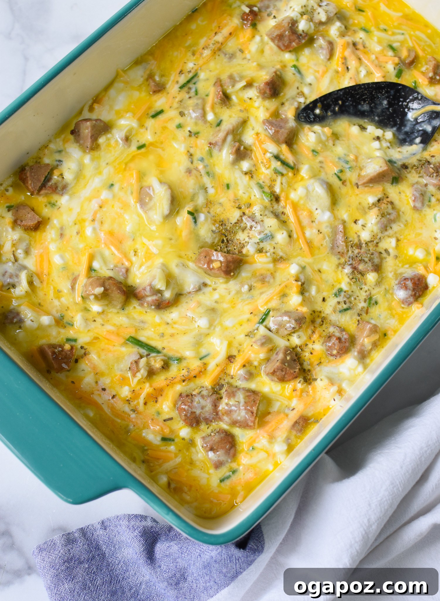 Savory Cottage Cheese Egg Bake 8 The full Cottage Cheese Baked Eggs mixture has been smoothly poured into a 9x13 inch casserole dish, perfectly spread out and ready for the oven.