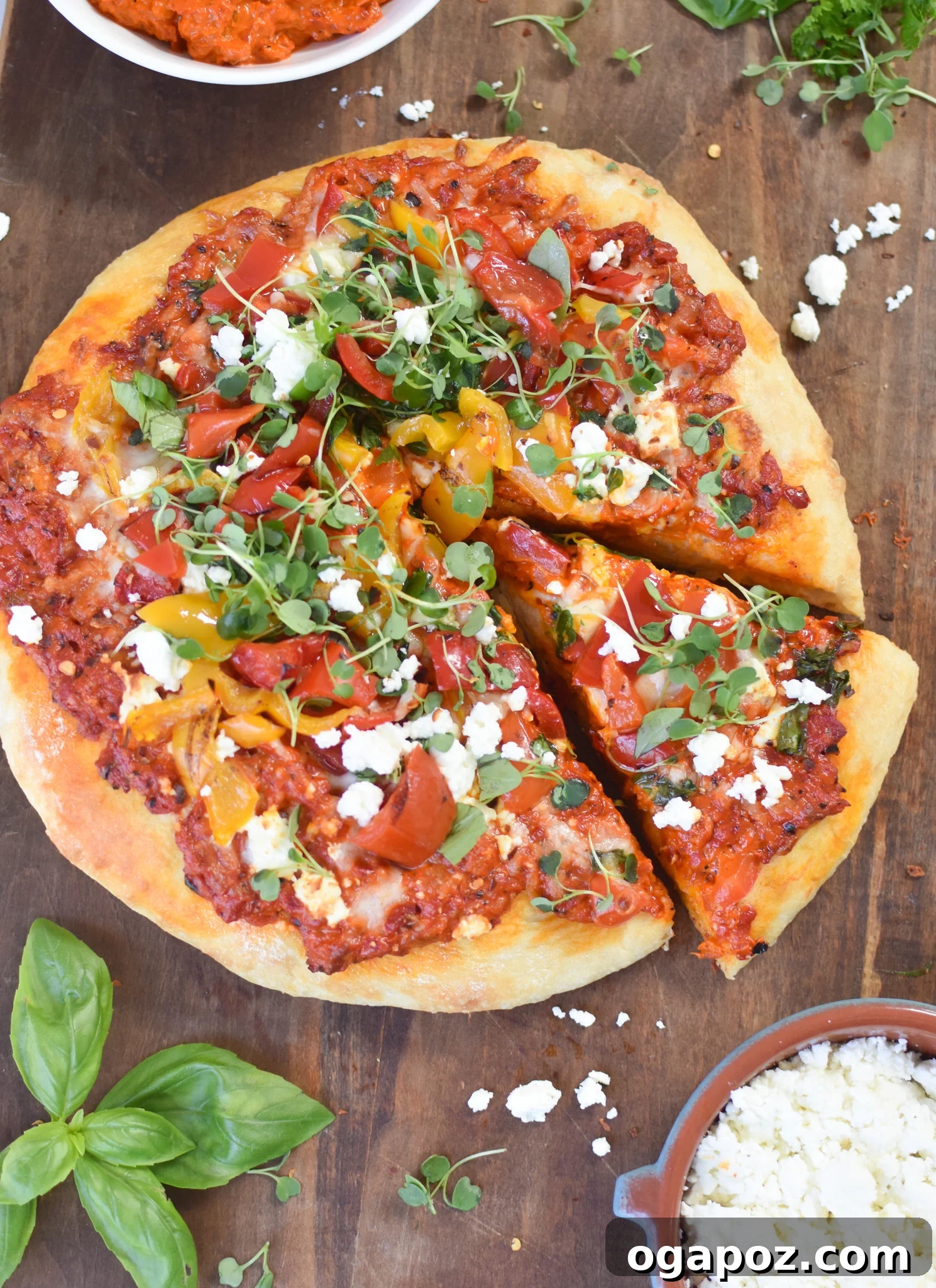 Sun-Kissed Mediterranean Skillet Pizza 7 A delectable slice of Cast Iron Mediterranean Pizza being lifted from the skillet with a spatula, showcasing its layers.
