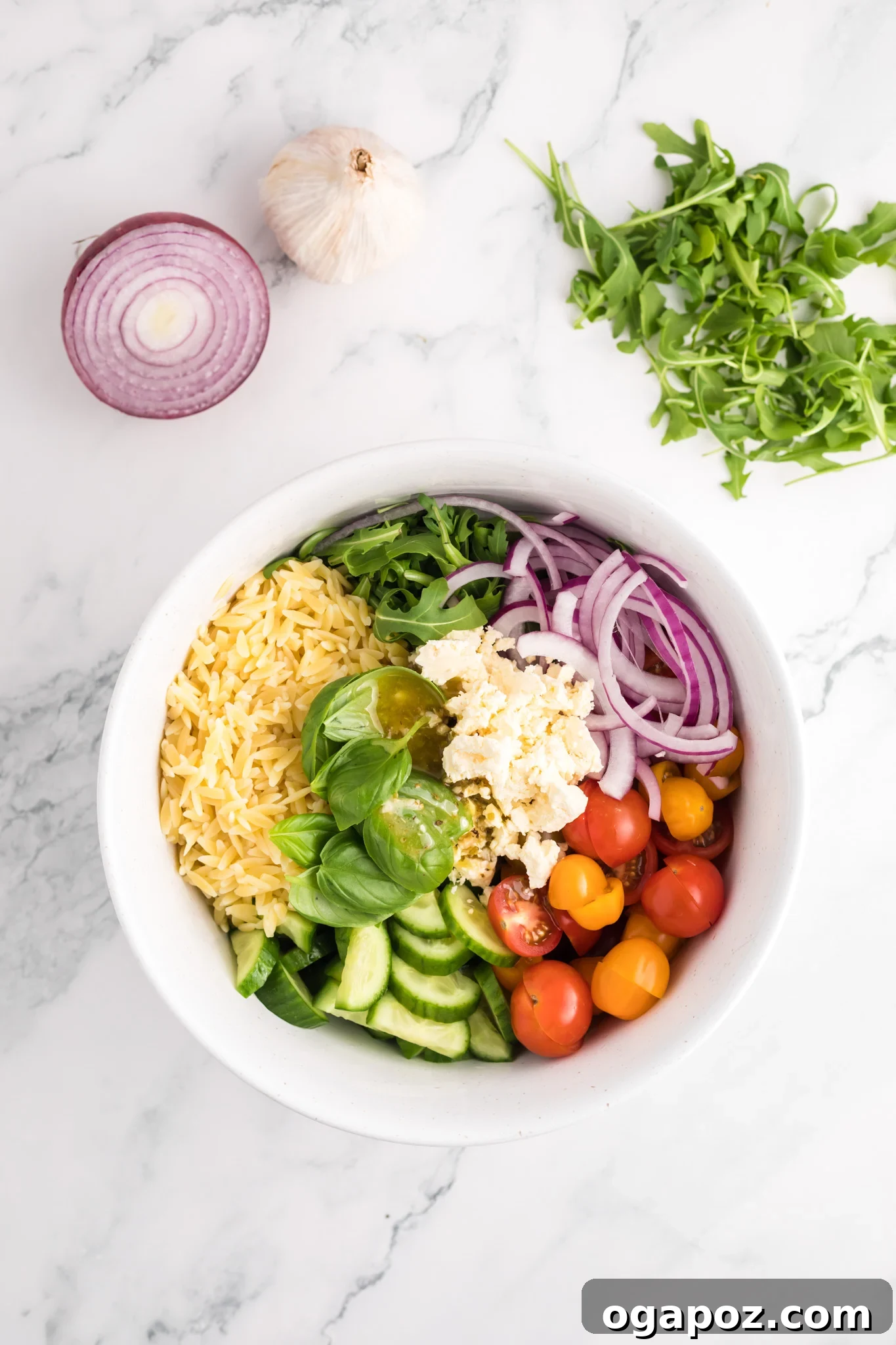Vibrant Arugula Orzo Salad 10 All salad ingredients, except dressing, combined in a large mixing bowl.