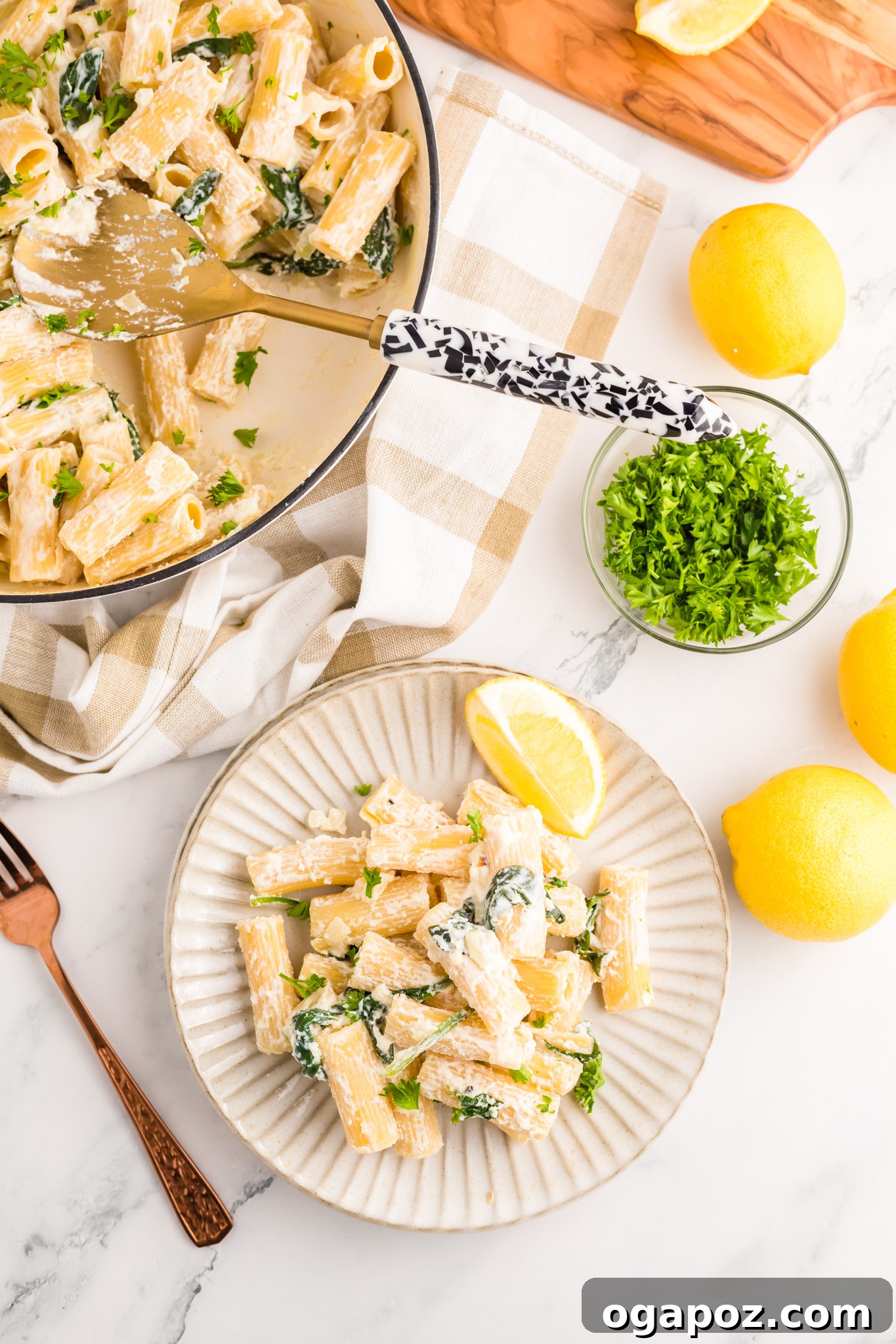 Velvety Lemon Ricotta Pasta 10 A generous serving of Lemon Ricotta Pasta on a white plate, garnished with fresh parsley and a lemon wedge, ready to be enjoyed.