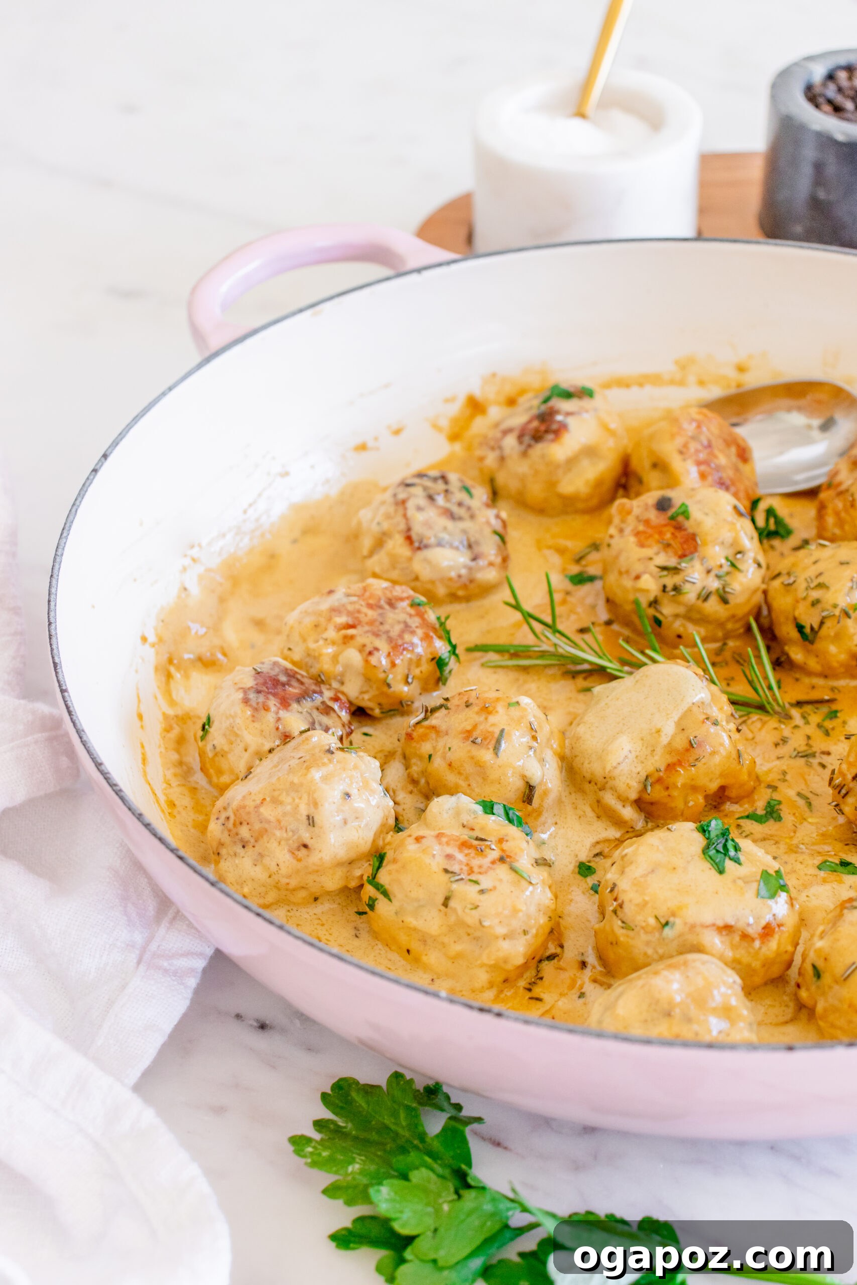 Sticky Maple Dijon Turkey Meatballs 13 Maple Dijon Turkey Meatballs served in a bowl with a spoon, highlighting the rich sauce.