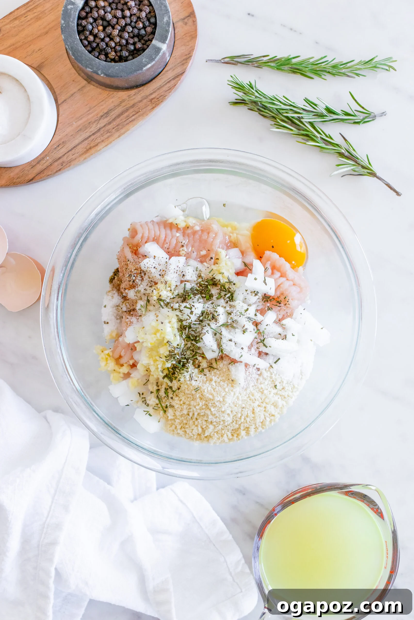 Sticky Maple Dijon Turkey Meatballs 8 Ingredients for turkey meatballs mixed in a large bowl.