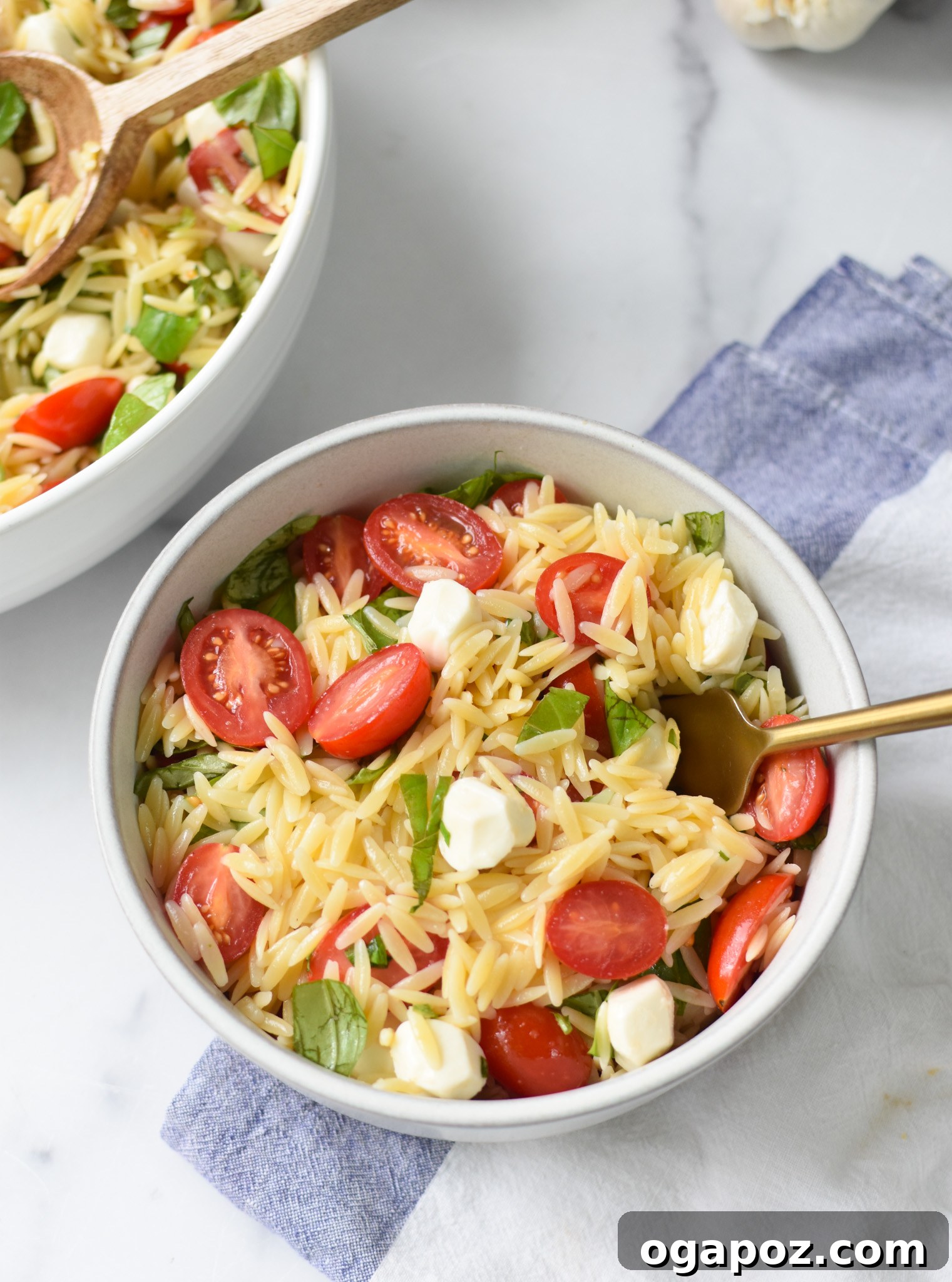 Fresh Caprese Orzo Salad 7 Caprese Orzo Pasta Salad with fork.