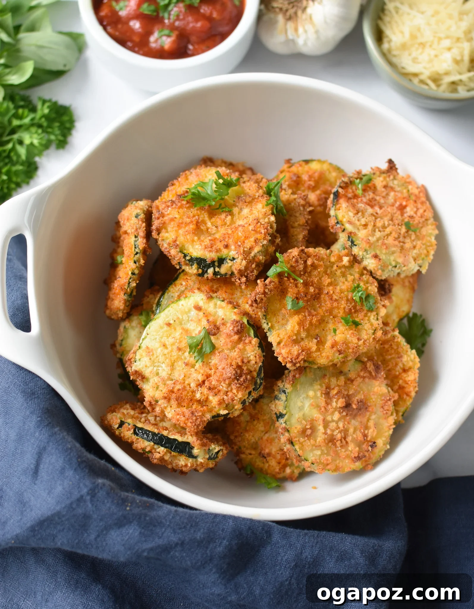 Crispy Air Fryer Zucchini Crisps 12 Air Fryer Zucchini Chips in a bowl with a blog logo watermark.