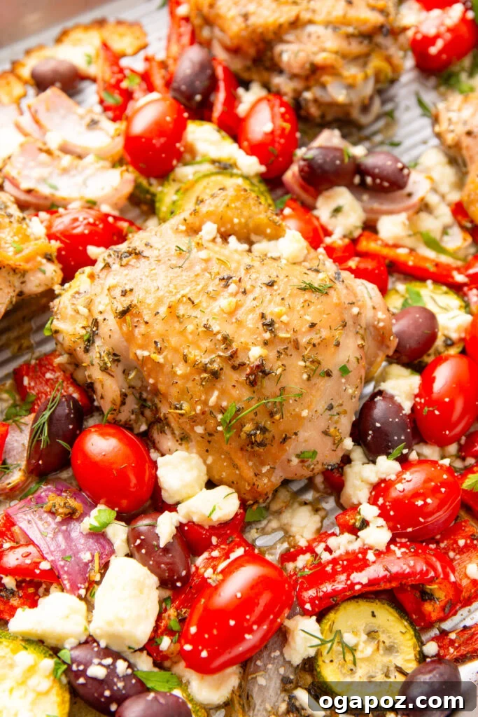 Zesty Mediterranean Sheet Pan Chicken 2 Mediterranean Sheet Pan Chicken on a sheet pan with feta cheese and fresh herbs
