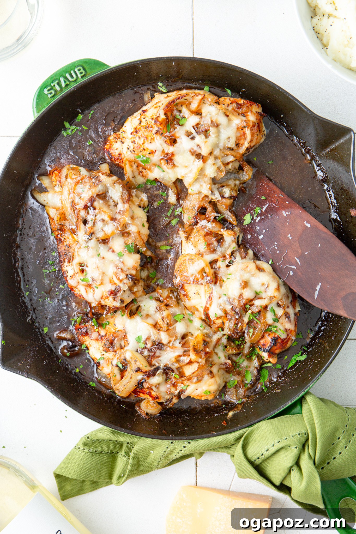 French Onion Smothered Chicken 11 French Onion Chicken in skillet, garnished with fresh parsley.