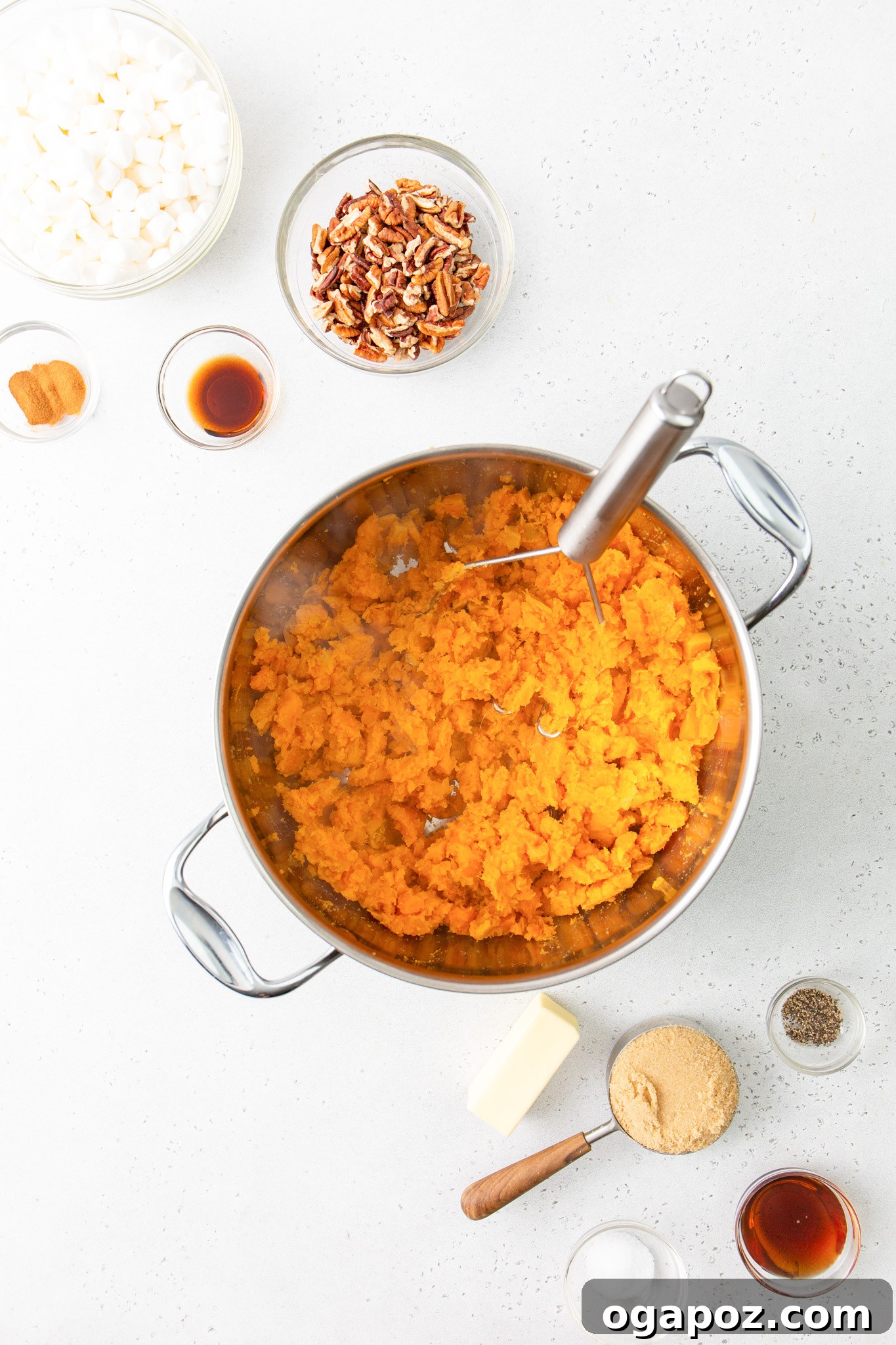 Golden Sweet Potato Marshmallow Delight 8 Sweet Potato Casserole with Marshmallows: mashed potatoes in a pot, showing their creamy texture