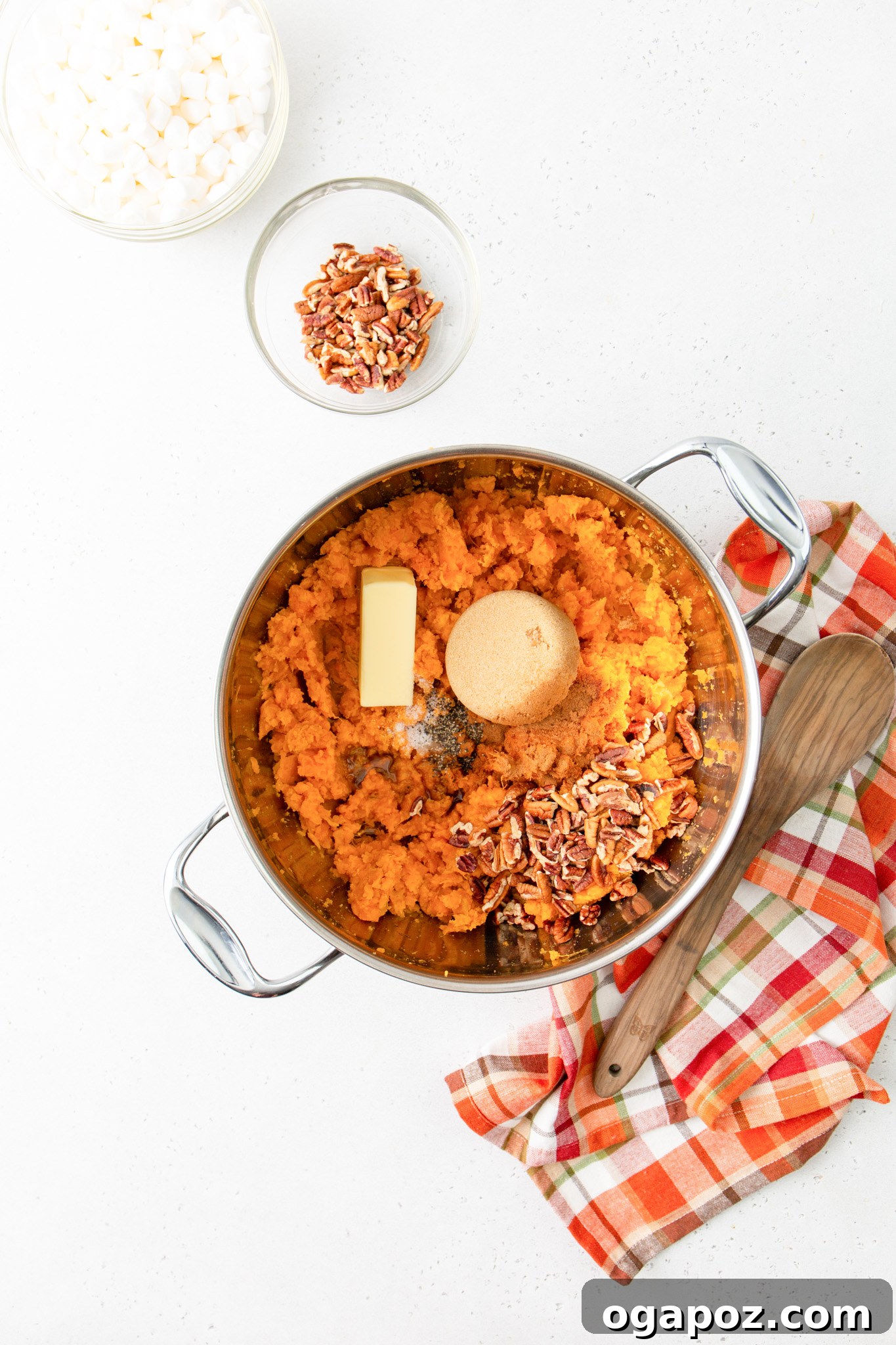Golden Sweet Potato Marshmallow Delight 10 Sweet Potato Casserole with Marshmallows: sweet potato mixture spread in a baking dish before adding topping