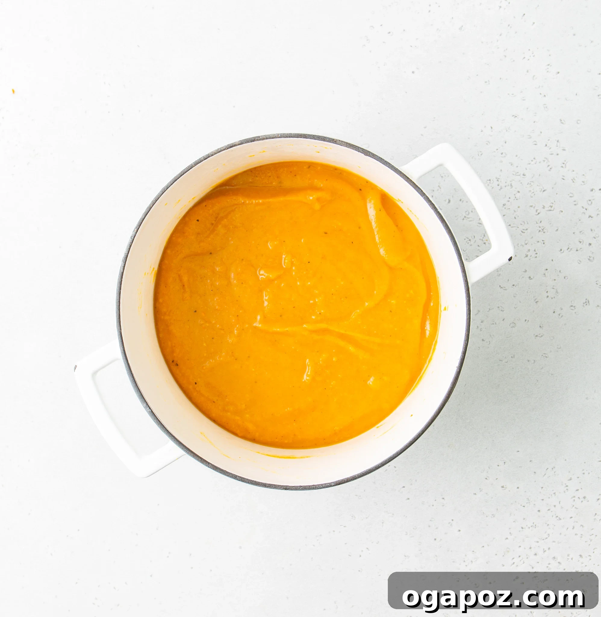 Creamy Roasted Butternut Squash Soup 10 Easy Roasted Butternut Squash Soup being blended in a Dutch oven with an immersion blender.