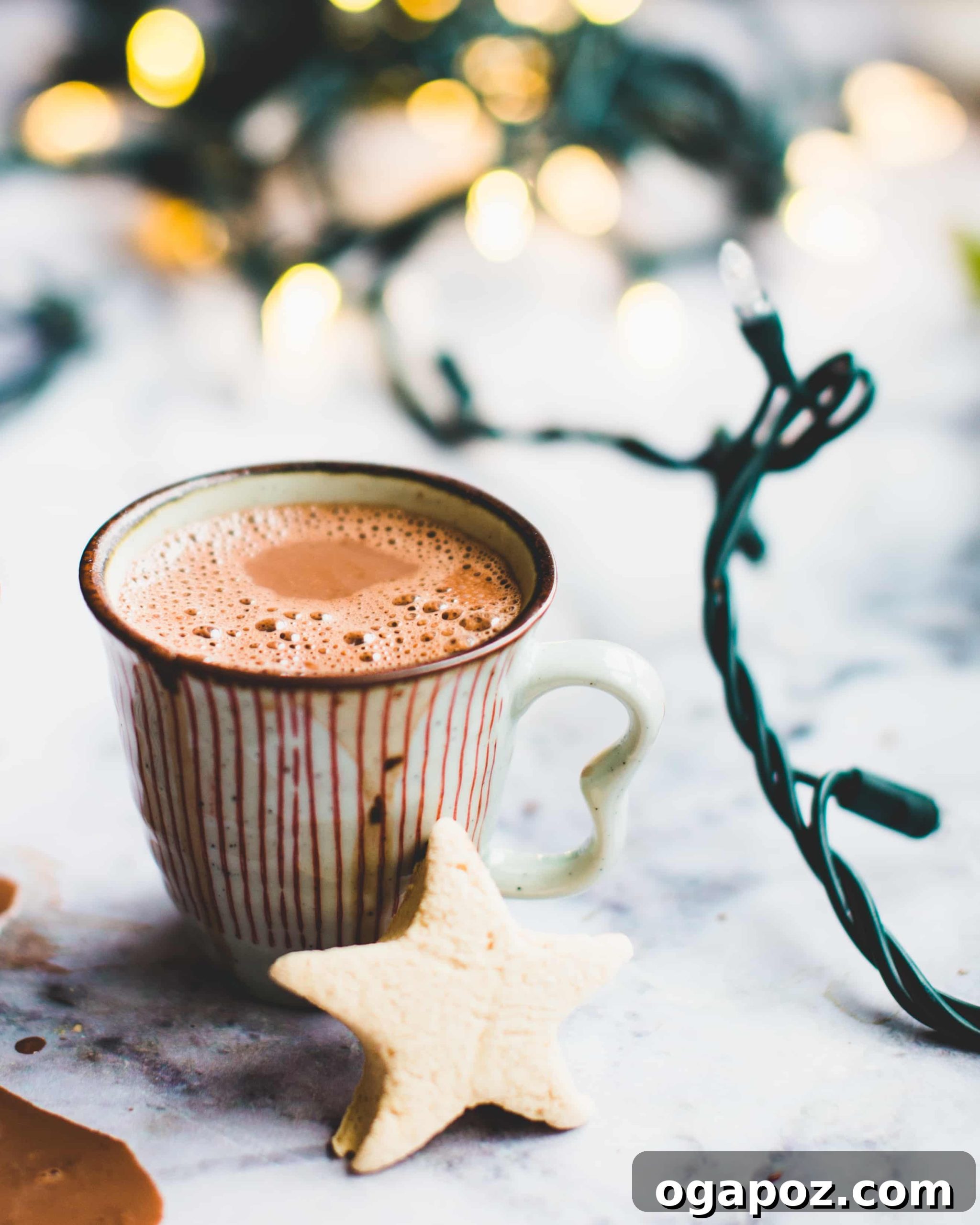 Wholesome Hot Chocolate 4 Cozy mug of healthier hot chocolate with a soft knitted scarf on a wooden surface
