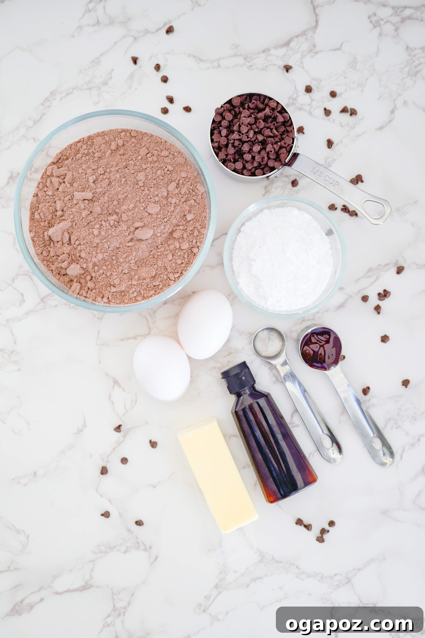 Decadent Chocolate Crinkle Cookies 4 A display of all the simple ingredients required to make the Chocolate Crinkle Cookie Recipe, including cake mix, eggs, butter, and sugars.
