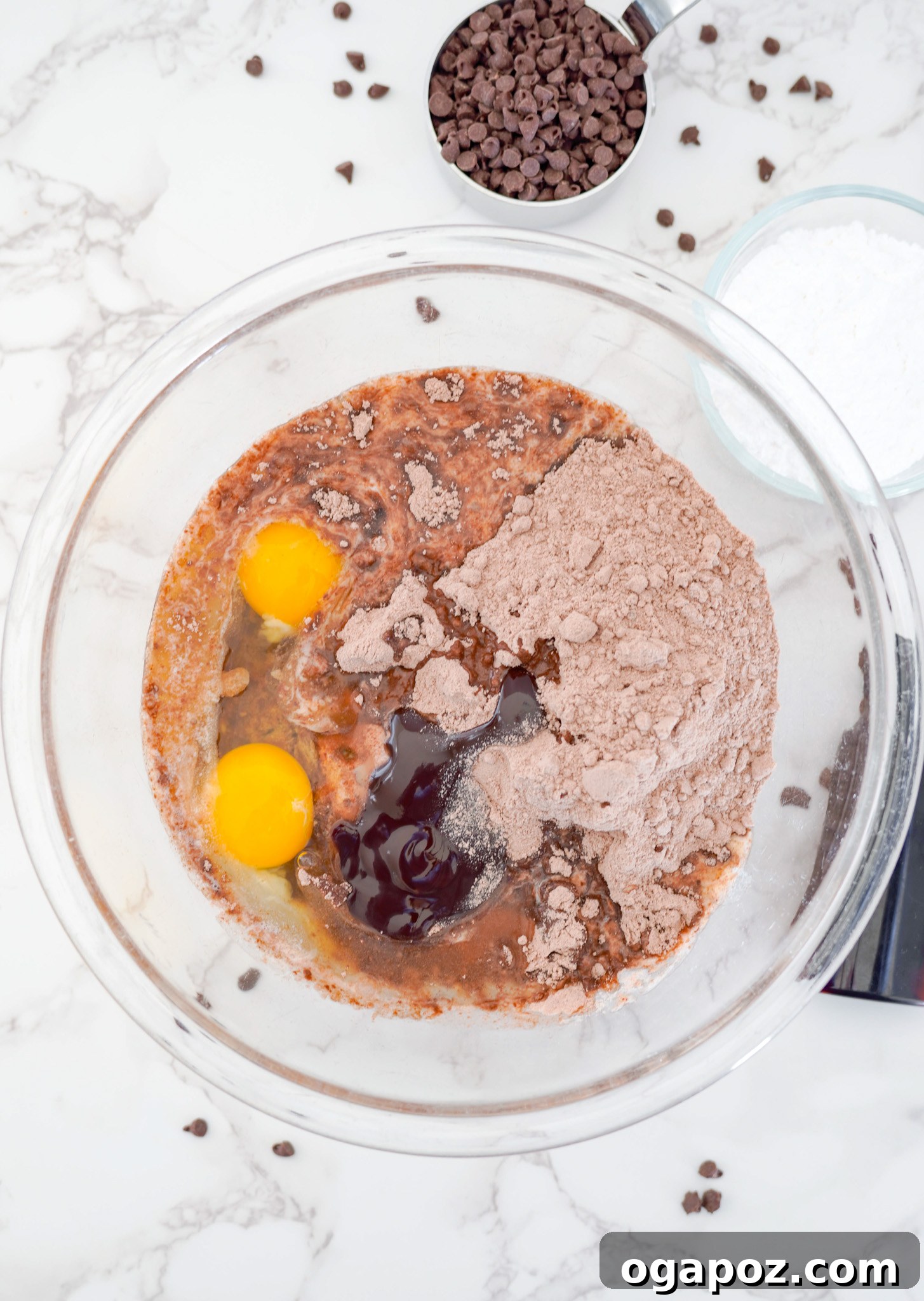 Decadent Chocolate Crinkle Cookies 6 Ingredients for Chocolate Crinkle Cookie Recipe being combined in a bowl, showcasing the initial mixing stage.