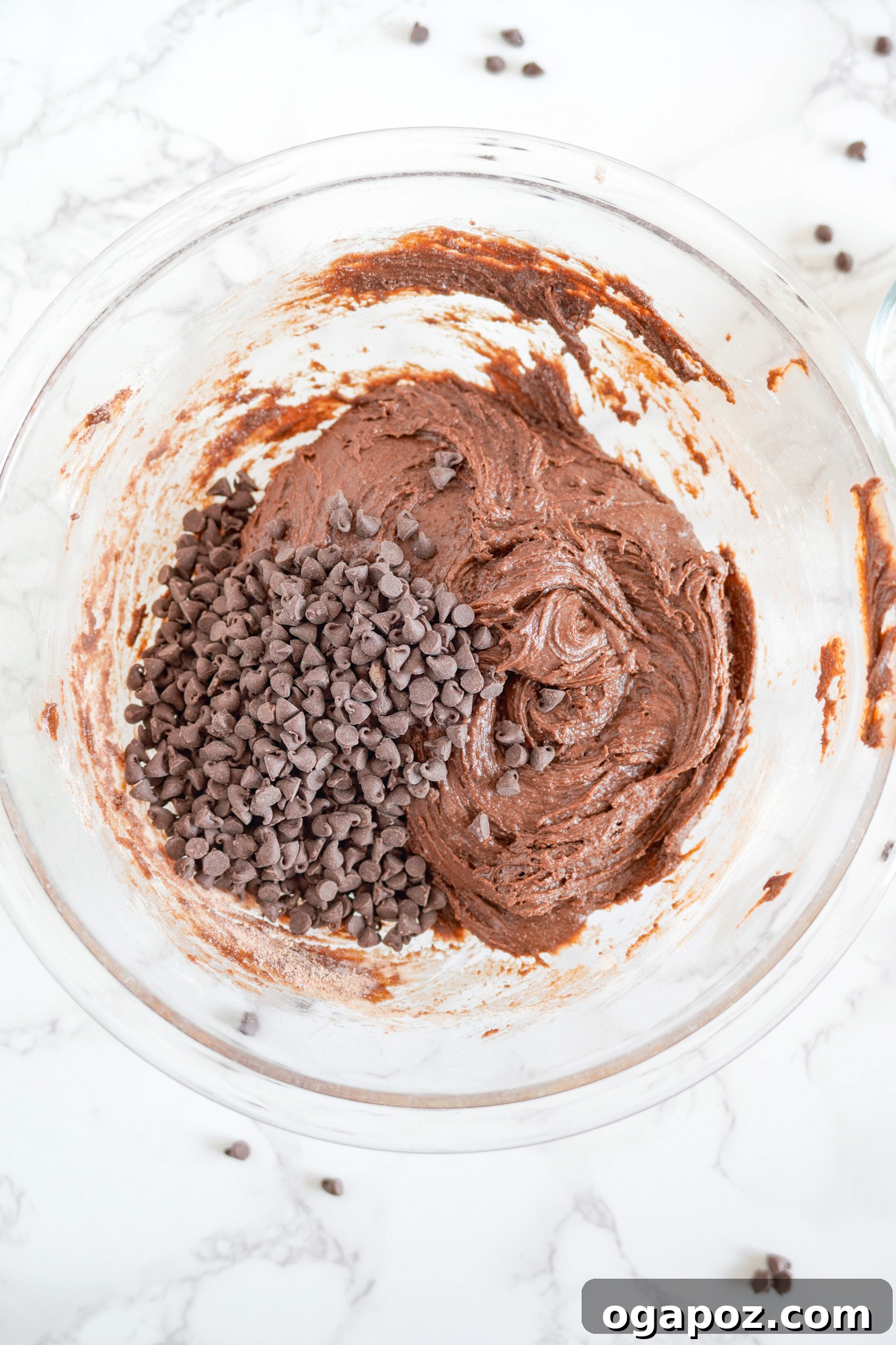 Decadent Chocolate Crinkle Cookies 8 Miniature chocolate chips being stirred into the rich Chocolate Crinkle Cookie Recipe dough.