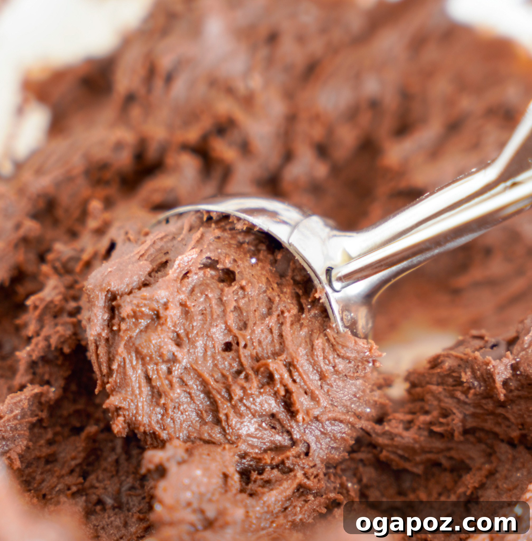 Decadent Chocolate Crinkle Cookies 9 Chocolate Crinkle Cookie Recipe dough in a cookie scoop, ready to be shaped.