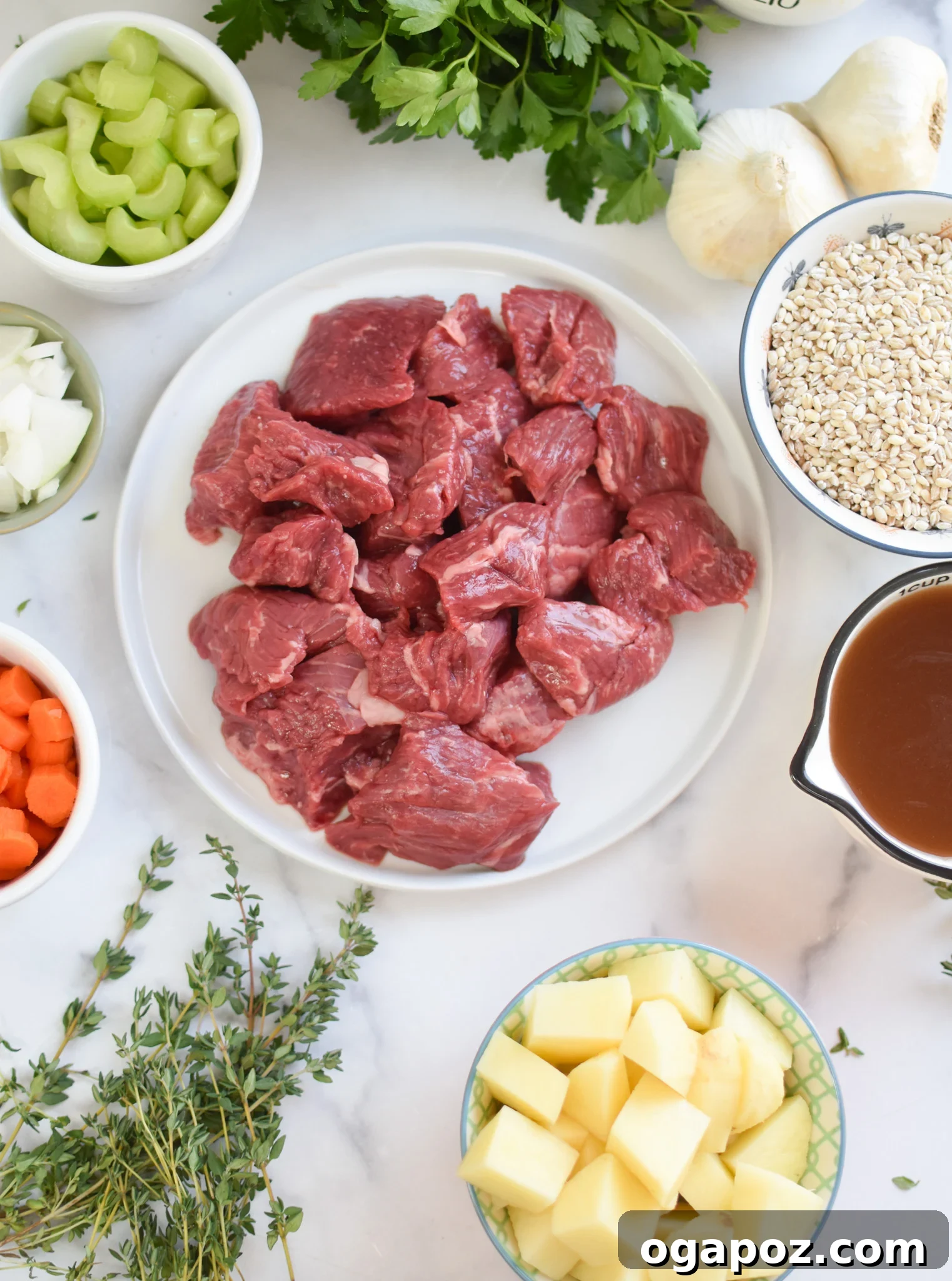 Hearty Slow-Simmered Beef Barley Soup 6 Fresh ingredients for Slow Cooker Beef Barley Soup laid out on a cutting board