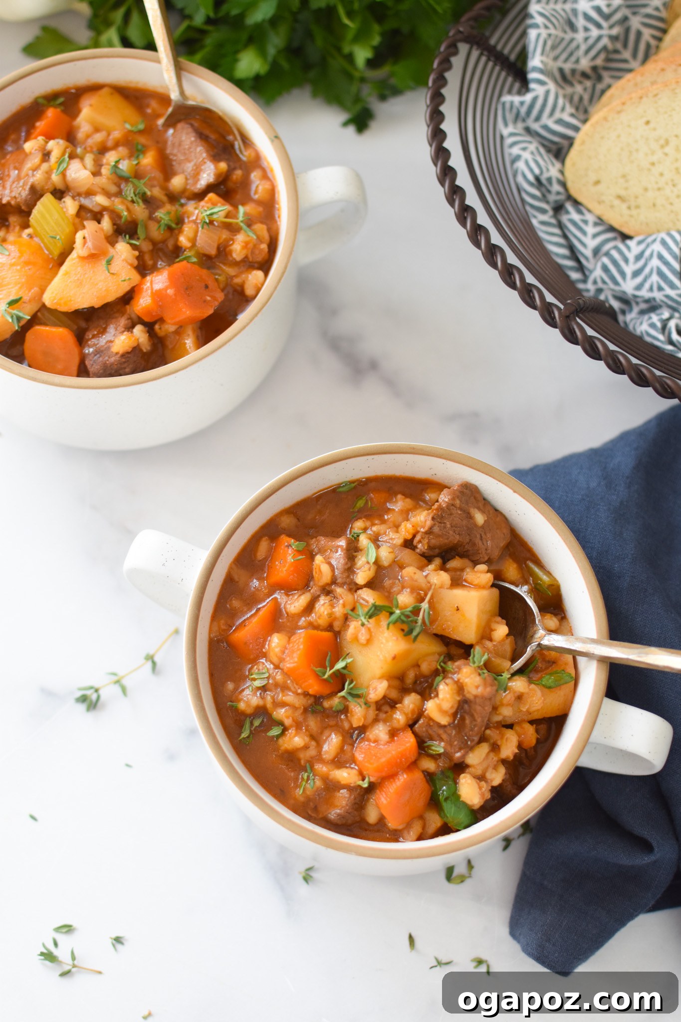 Hearty Slow-Simmered Beef Barley Soup 7 Slow Cooker Beef Barley Soup served in a bowl with a spoon, garnished with fresh parsley