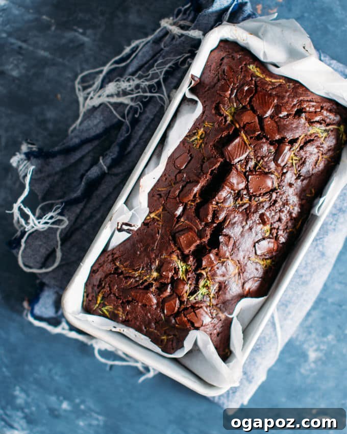 Hidden Veggie Chocolate Bread 5 Multiple slices of freshly baked chocolate zucchini bread cooling on a wire rack, emphasizing their delightful appearance and readiness to be enjoyed.