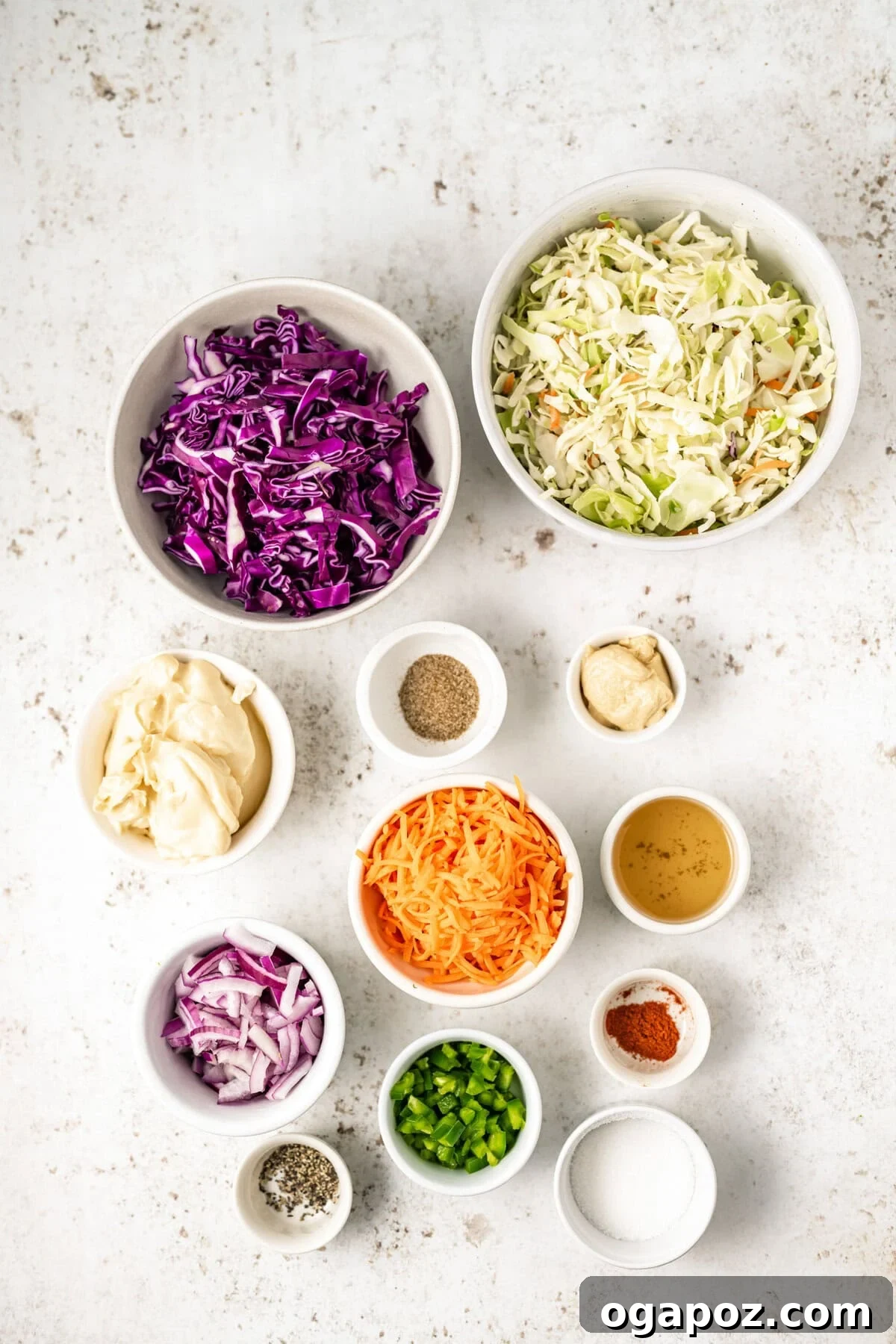 Kickin' Creamy Jalapeno Coleslaw 6 A selection of fresh ingredients for Jalapeno Coleslaw, including shredded cabbage, carrots, red onion, and jalapeños.