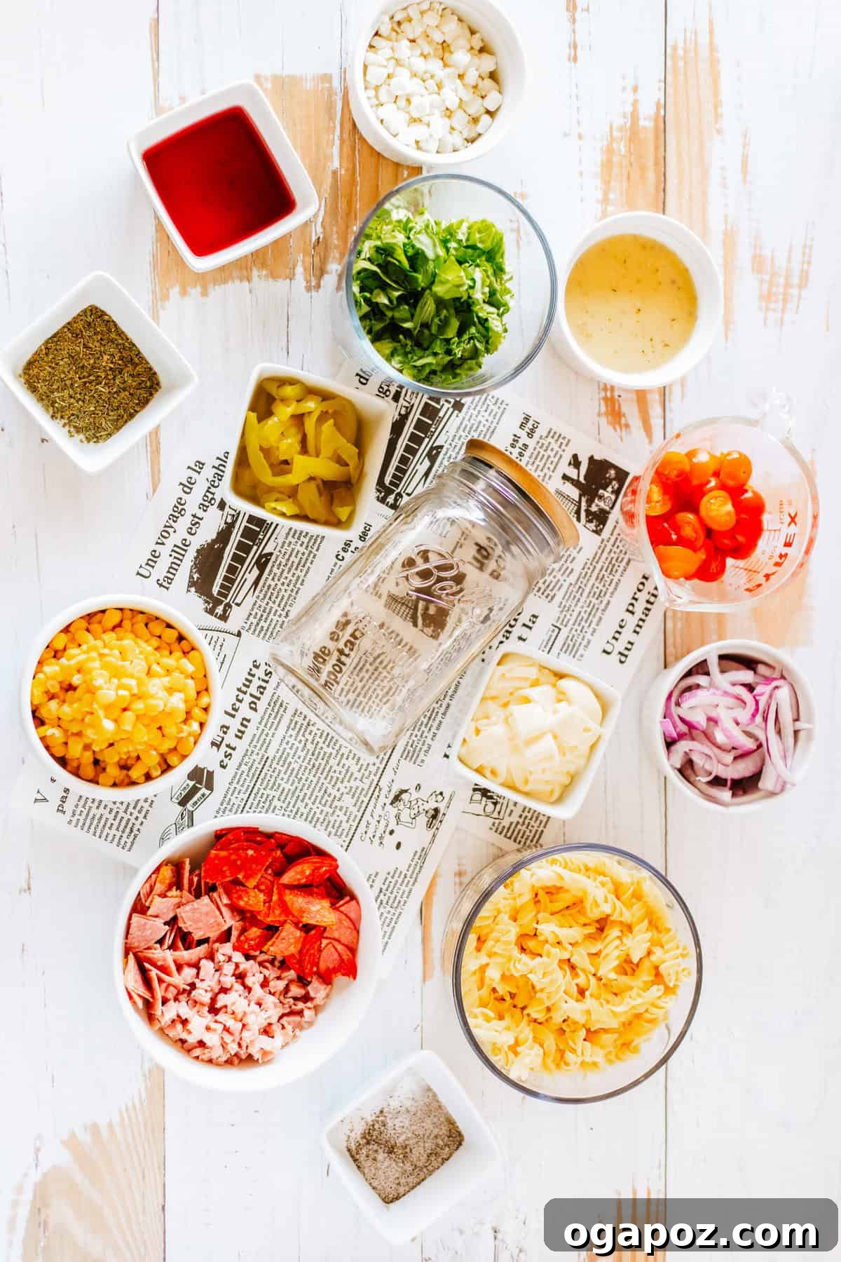 Portable Italian Pasta Salad Jars 4 Individual ingredients laid out for preparing the Italian Pasta Mason Jar Salad.