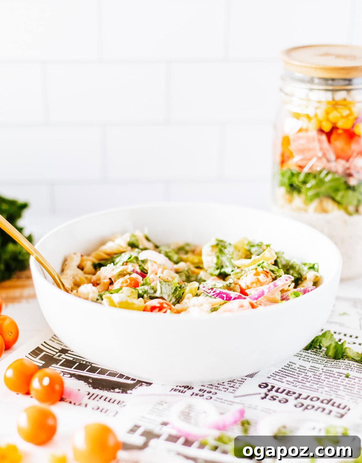 Portable Italian Pasta Salad Jars 5 The Italian Pasta Mason Jar Salad poured into a bowl, ready to be enjoyed.