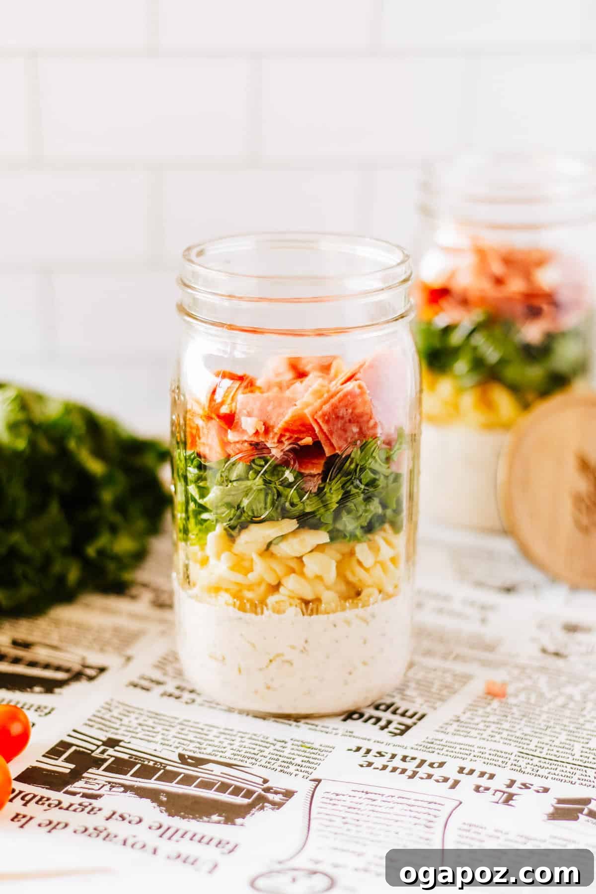 Various layers of the Italian Pasta Mason Jar Salad visible inside a mason jar.