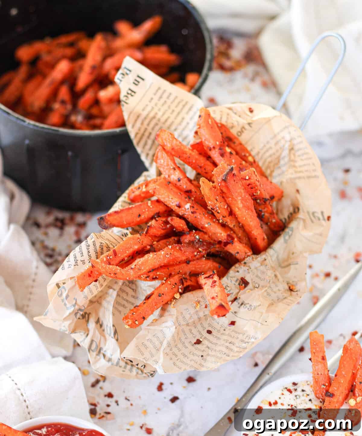 Crispy Air-Fried Sweet Potato Fries 2 A cup filled with golden, crispy Air Fryer Sweet Potato Fries, perfect for a side dish or snack.