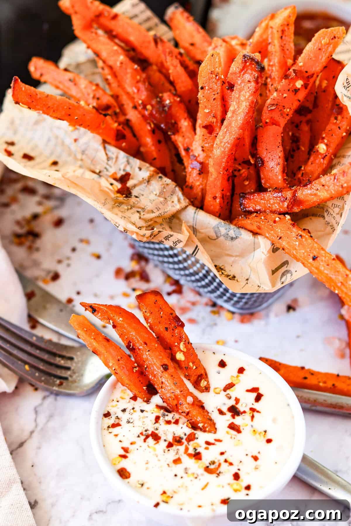 Crispy Air-Fried Sweet Potato Fries 8 Air Fryer Sweet Potato Fries served with a creamy dipping sauce.
