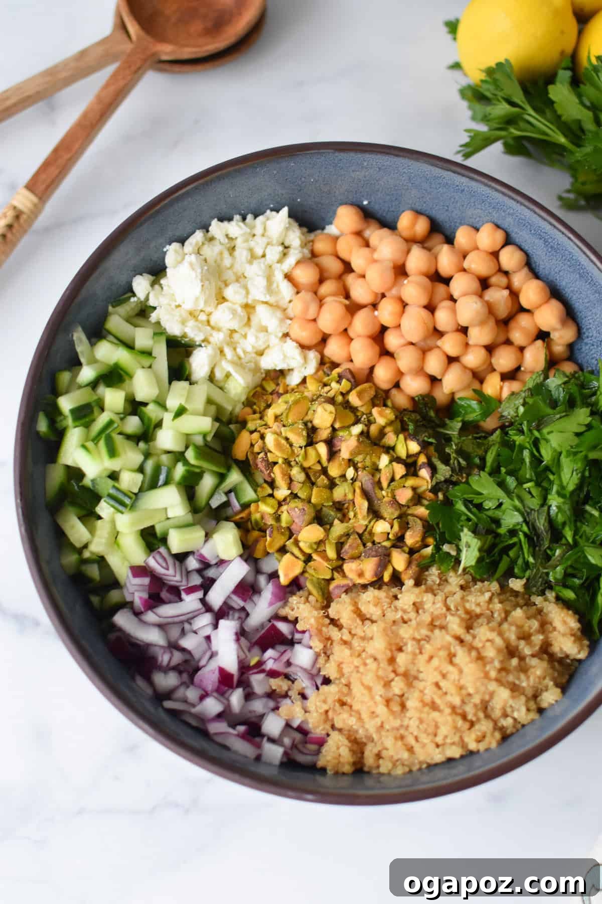 All the meticulously prepared ingredients for the Jennifer Aniston Salad, gathered in a large bowl and ready for combination.