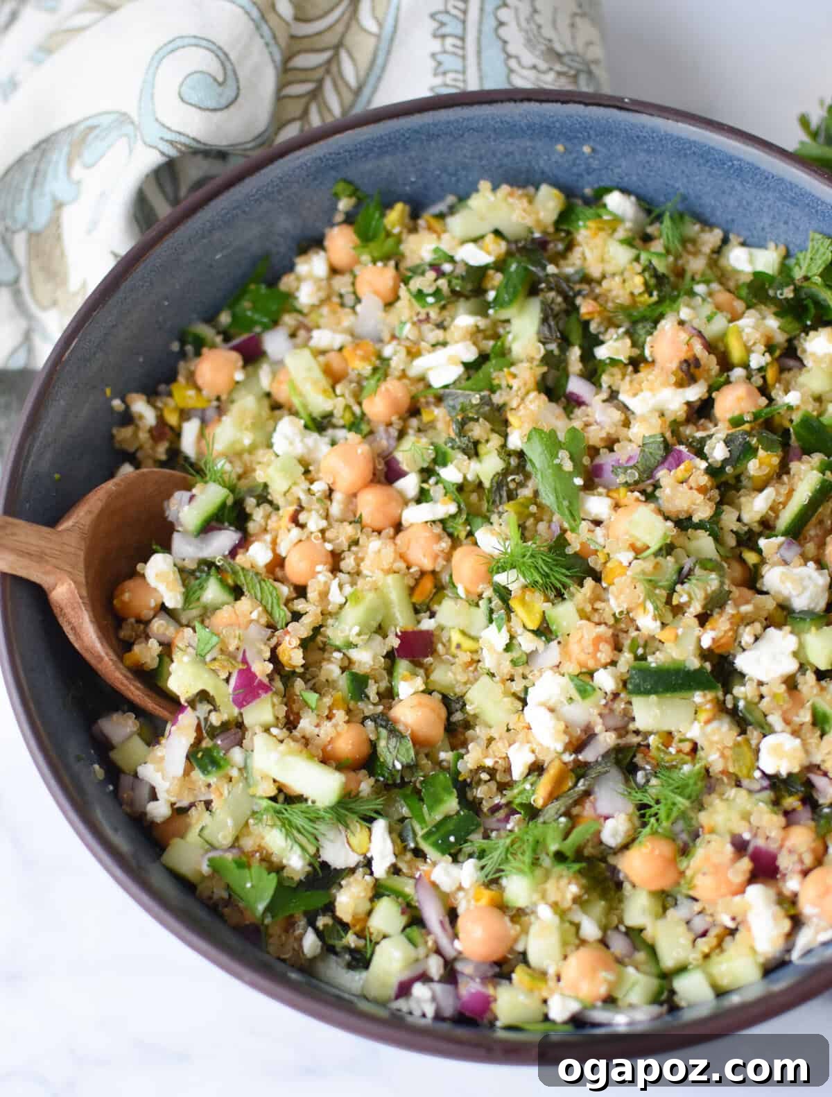 All the vibrant ingredients for the Jennifer Aniston Salad, perfectly combined in a large, inviting salad bowl.