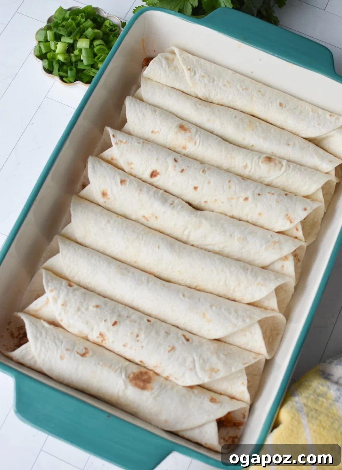 Weeknight Pork Enchilada Bliss 5 Neatly rolled pork enchiladas arranged seam-side down in a glass baking dish