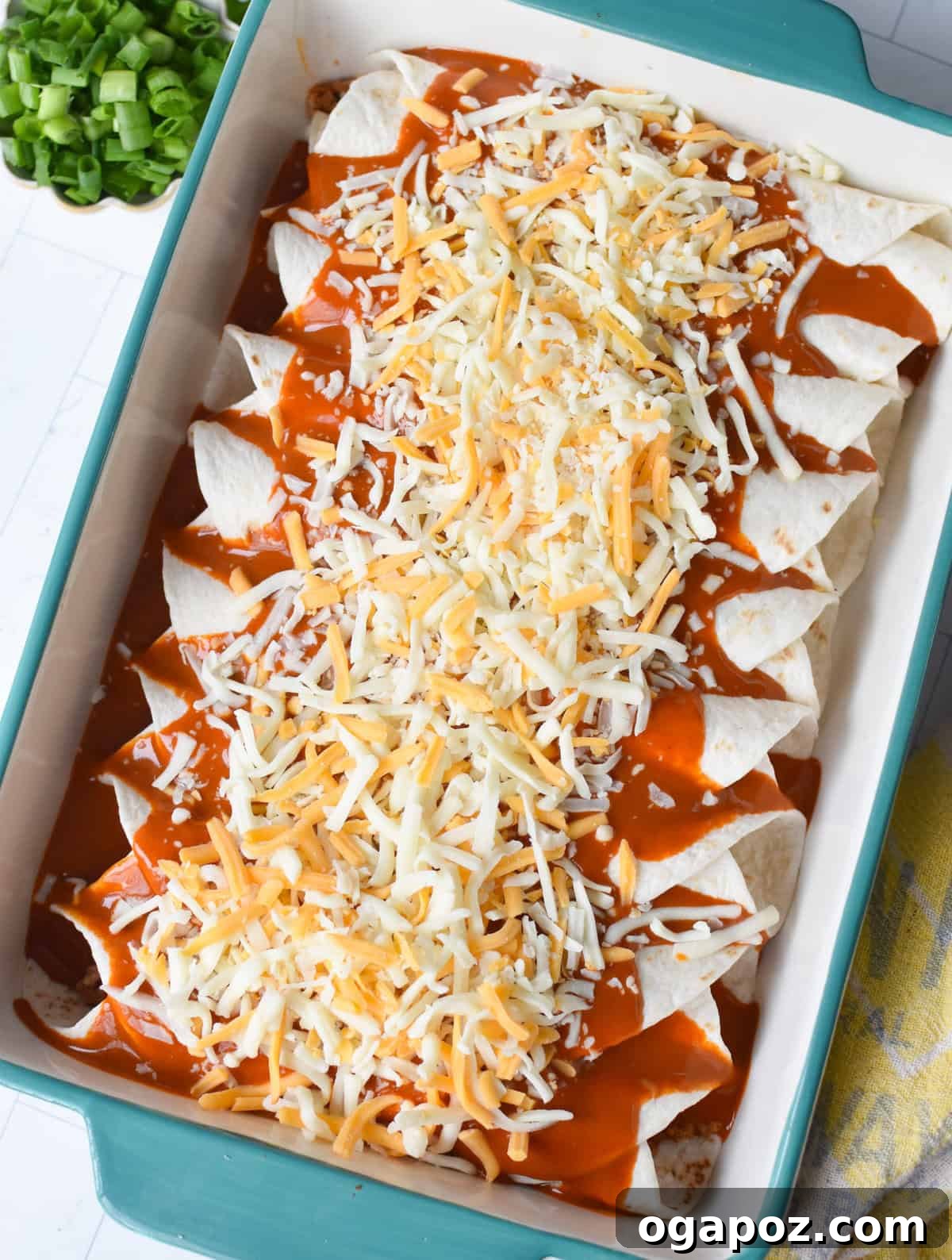 Weeknight Pork Enchilada Bliss 6 Pork enchiladas covered with rich red enchilada sauce and shredded cheese before baking