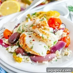 Sheet Pan Mediterranean Cod on a white bowl with fork