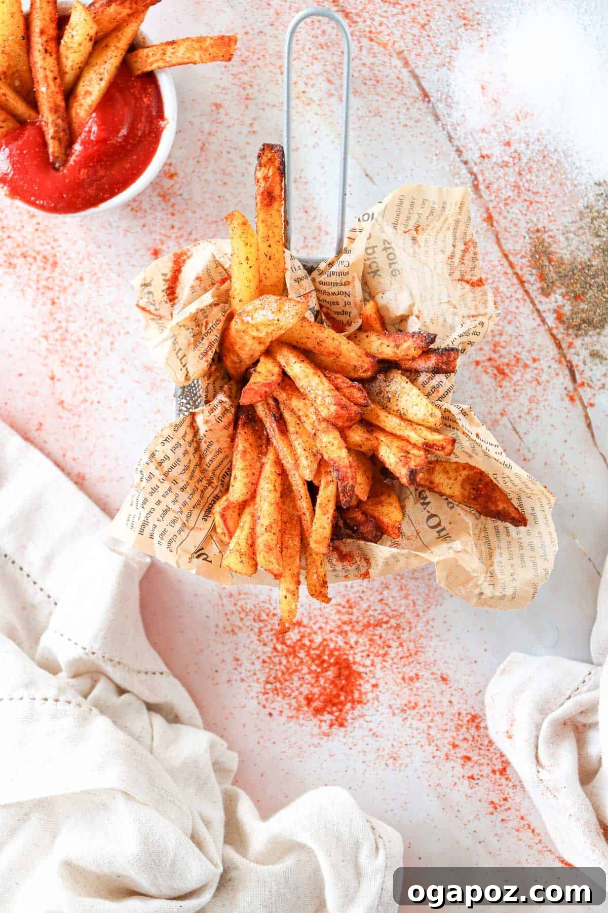 Crispy Air Fryer French Fries 3 Air Fryer French Fries Recipe showing seasoning being applied before cooking
