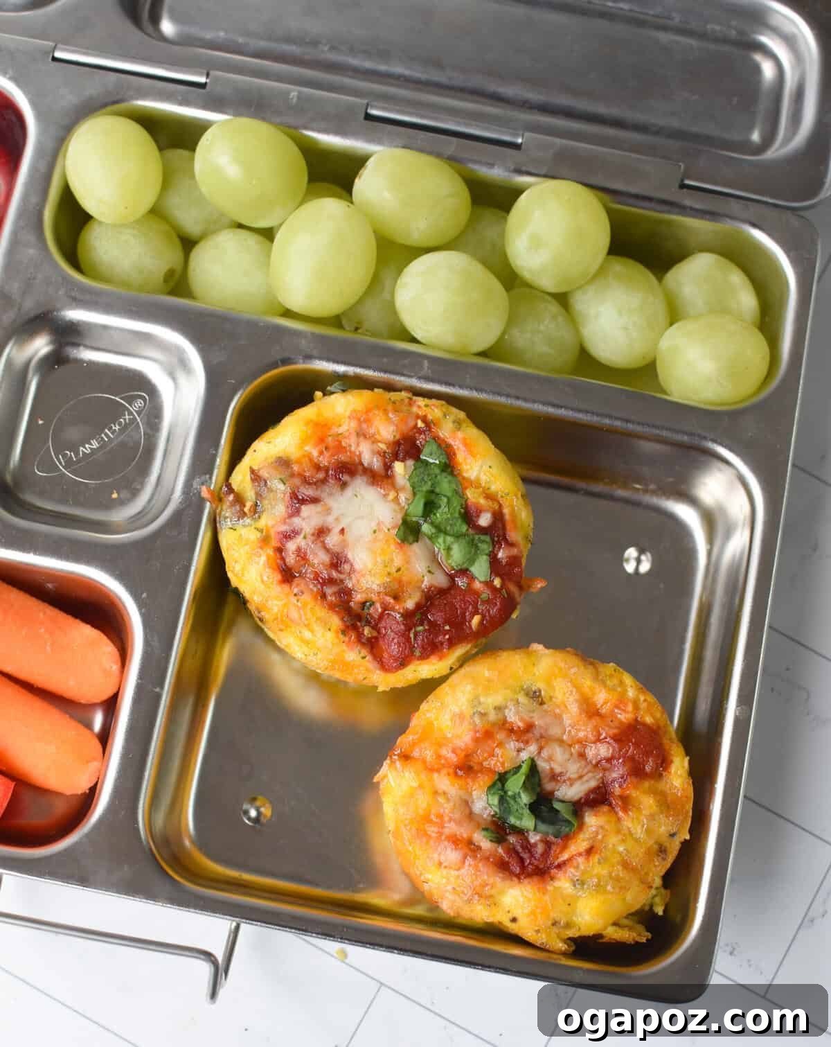 Savory Pizza Egg Cups 9 Perfectly packed Pizza Egg Muffins in a lunchbox, showcasing an ideal meal solution for school or work.