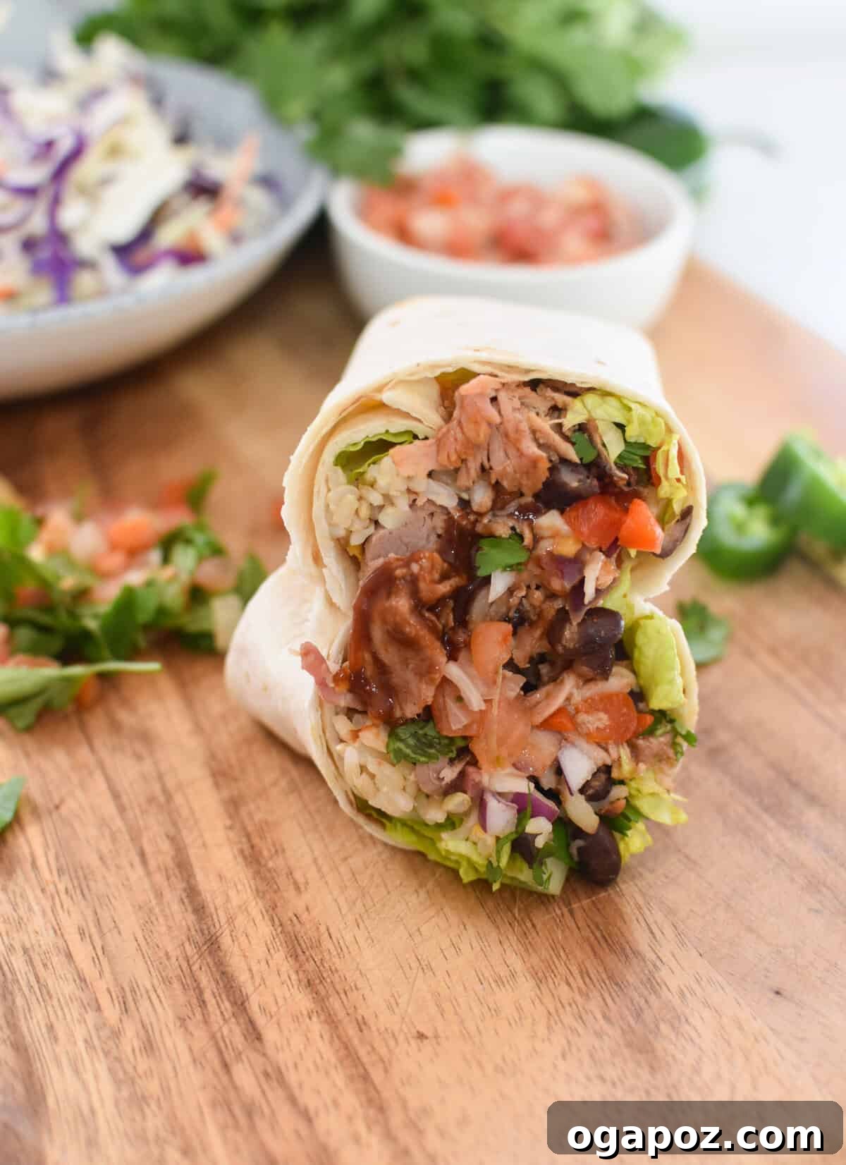 Ultimate Pulled Pork Wraps 3 Pulled Pork Burritos on a cutting board