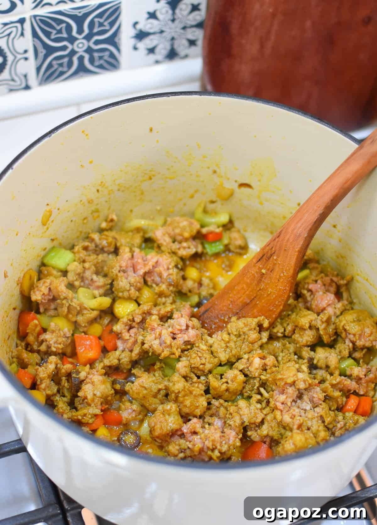 Hearty Lentil and Sausage Soup 8 Lentil Sausage Soup Recipe sausage and lentils in a pot.