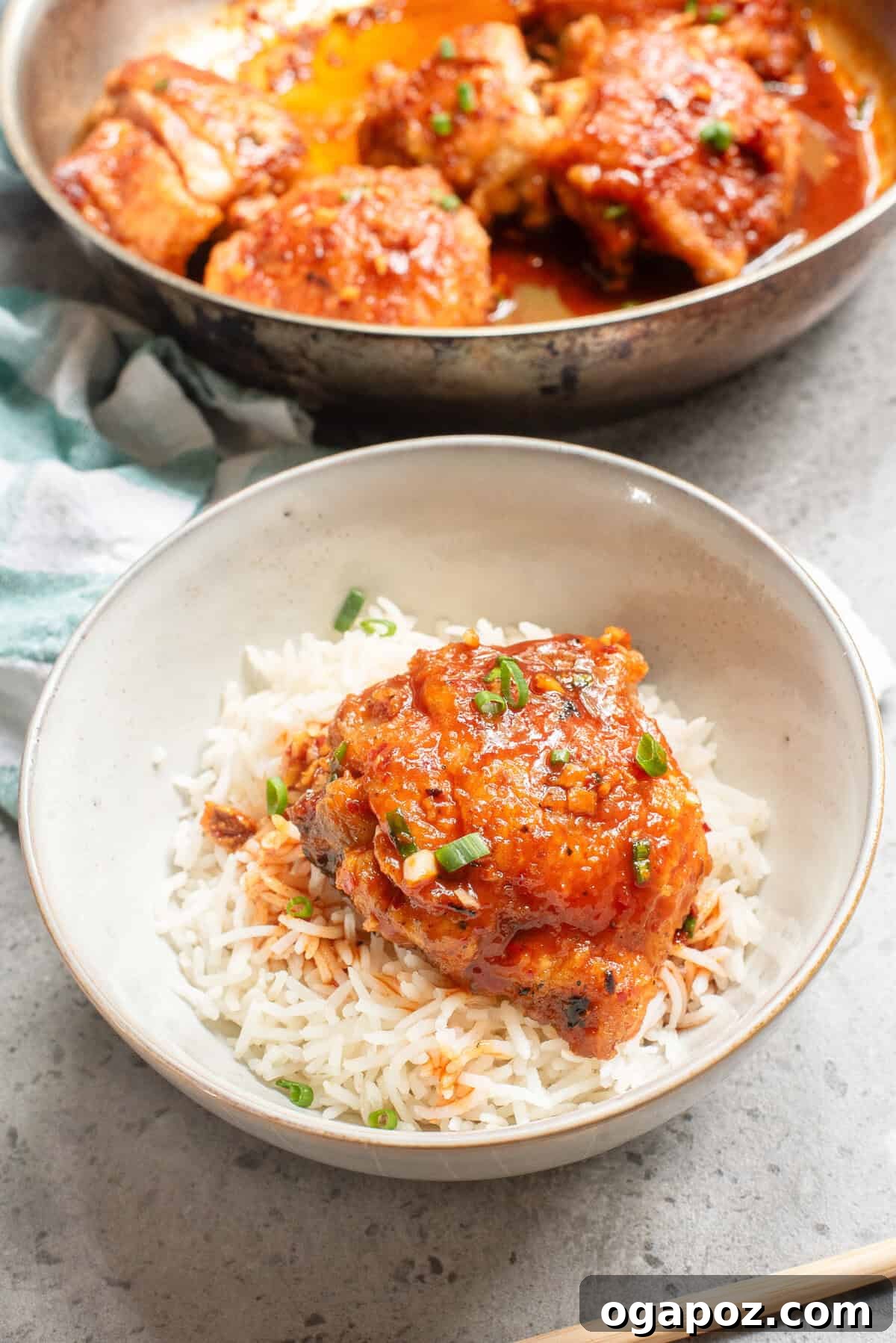 Sticky Honey Ginger Chicken 3 Honey Ginger Chicken served in a bowl with rice and garnishes