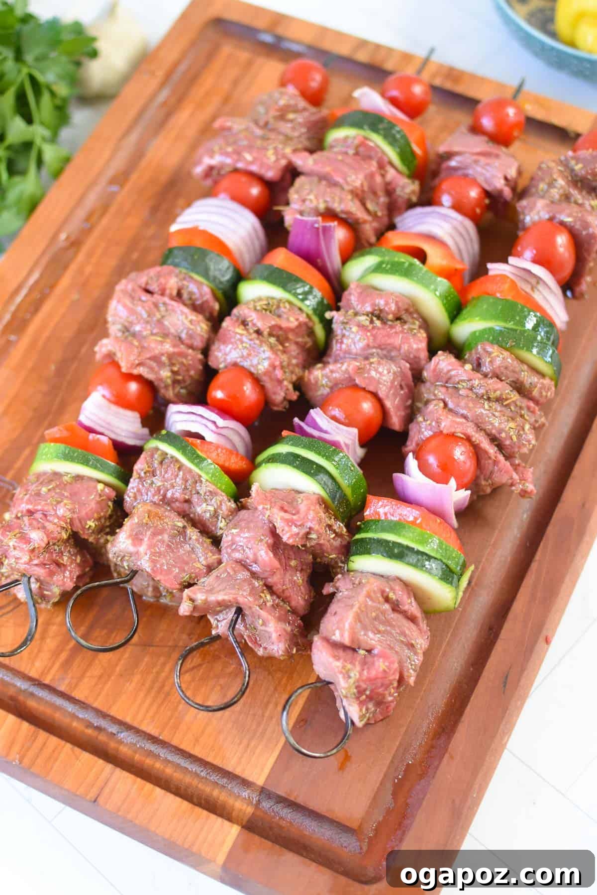 Grilled Beef Souvlaki Skewers 10 Beef Souvlaki skewers threaded on a cutting board, ready for the grill.