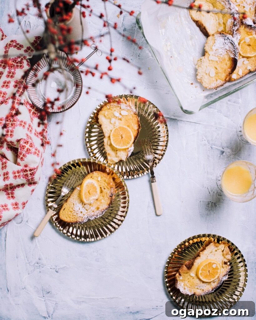 Zesty Orange French Toast Bake 6 Individual slices of Orange Cream French Toast Casserole elegantly dusted with powdered sugar, ready to be enjoyed.