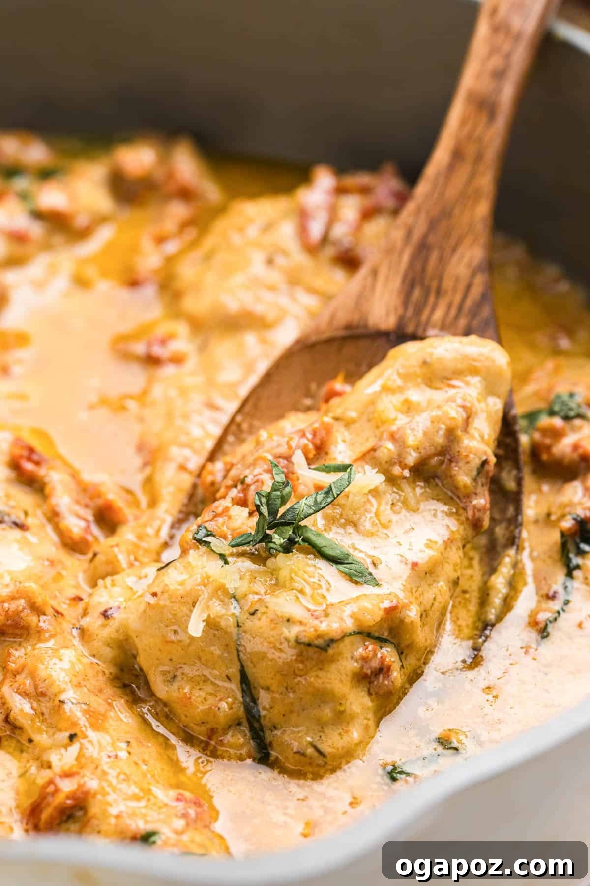 Proposal Perfect Chicken 3 A spoonful of Marry Me Chicken, showcasing the creamy sauce and tender chicken