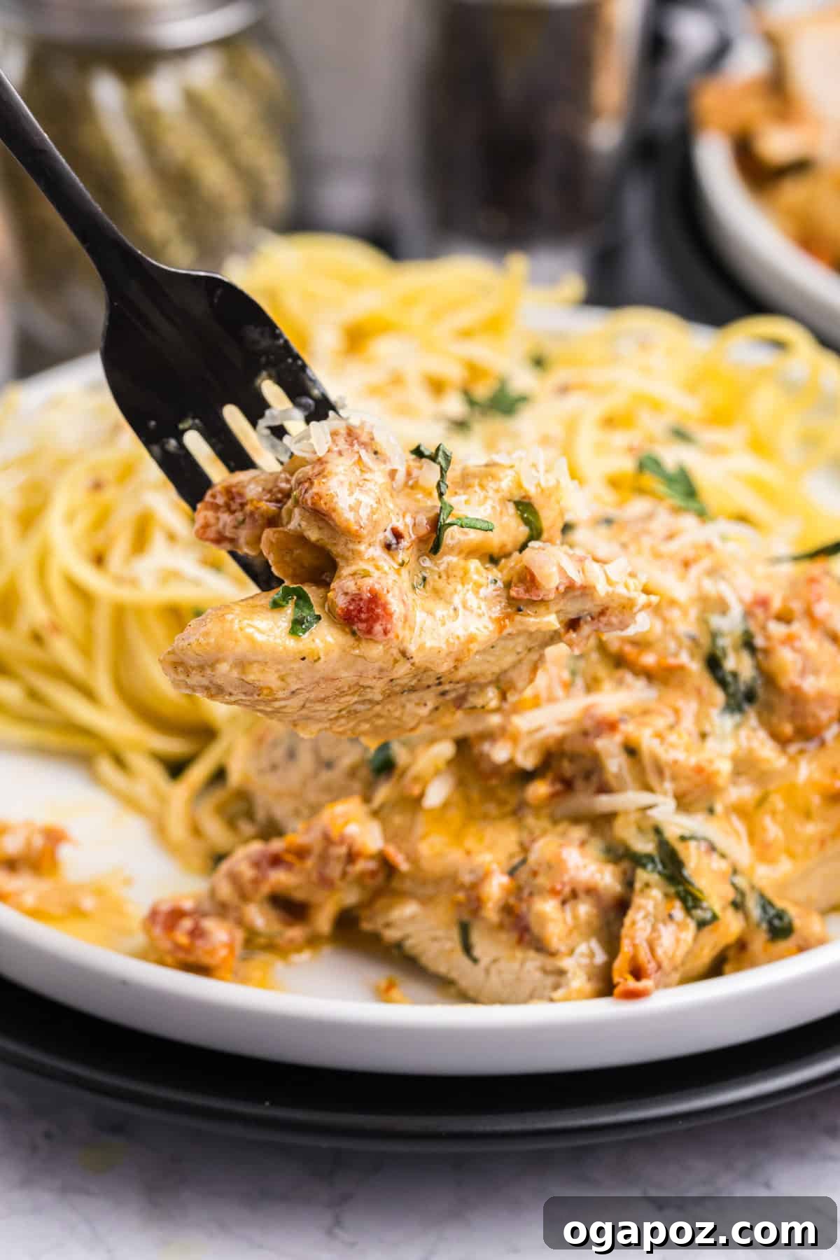 Proposal Perfect Chicken 7 Marry Me Chicken being served with a fork, ready to be enjoyed.