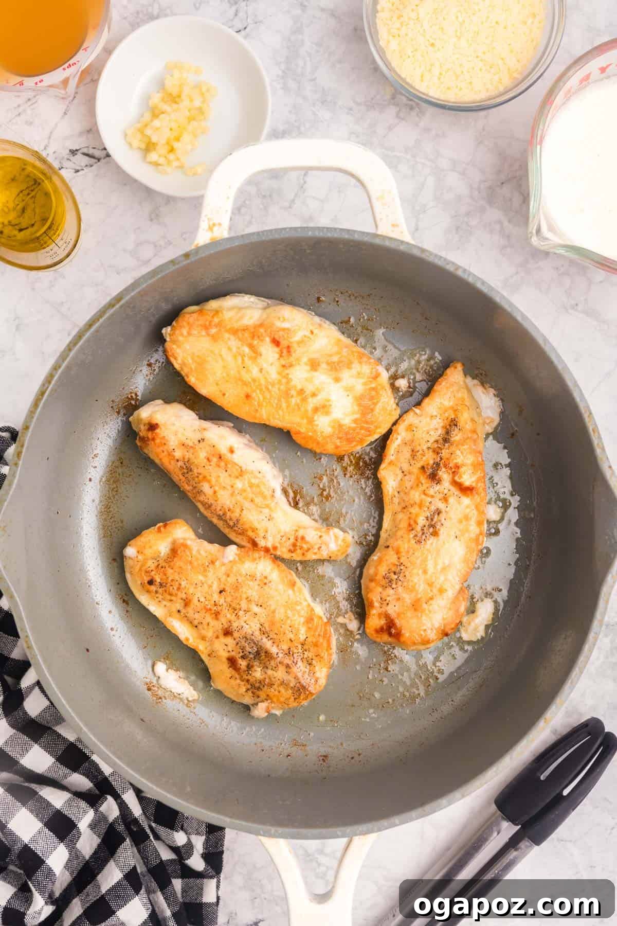 Proposal Perfect Chicken 9 Chicken breasts browning in a hot skillet with olive oil.