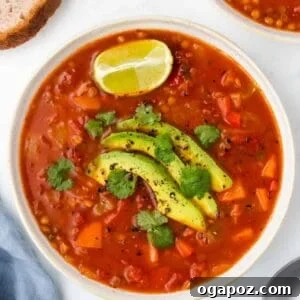 Flavorful Mexican Lentil Stew 12 Mexican Lentil Soup with cilantro and lime wedges.
