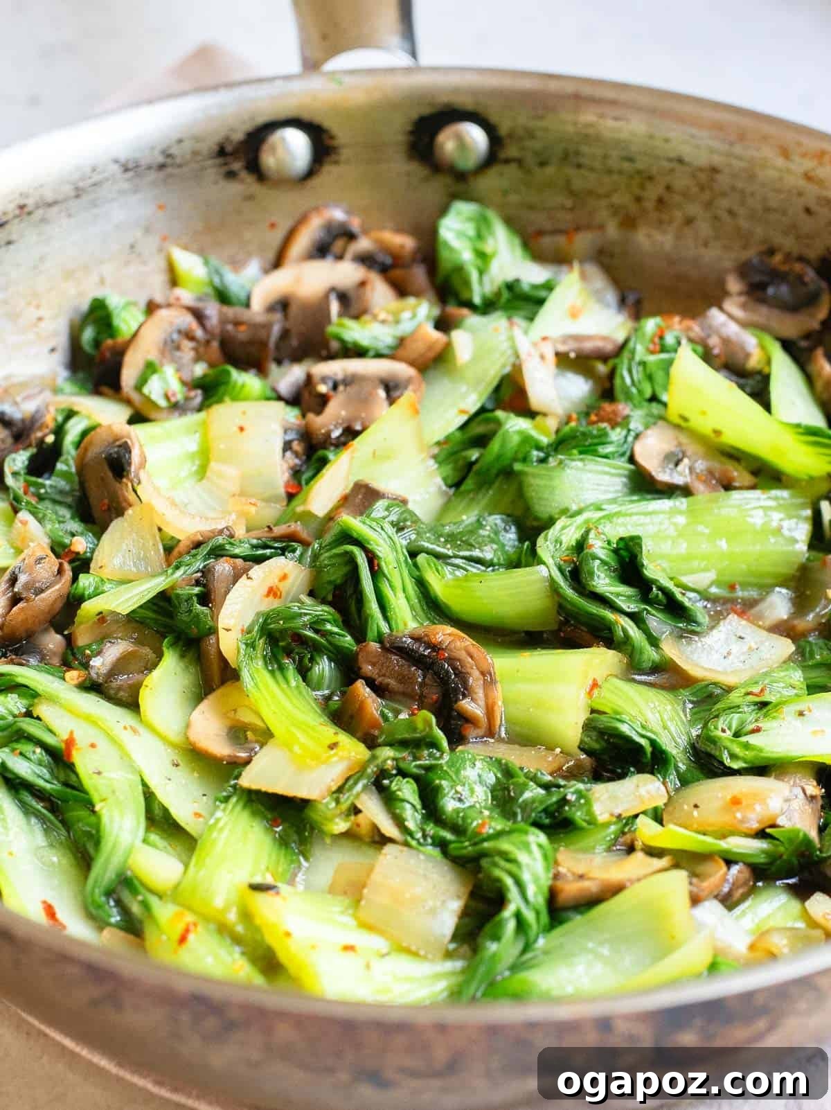 Vibrant Garlic Bok Choy Sauté 2 Bok Choy Stir Fry in large skillet, showcasing vibrant green bok choy and brown mushrooms