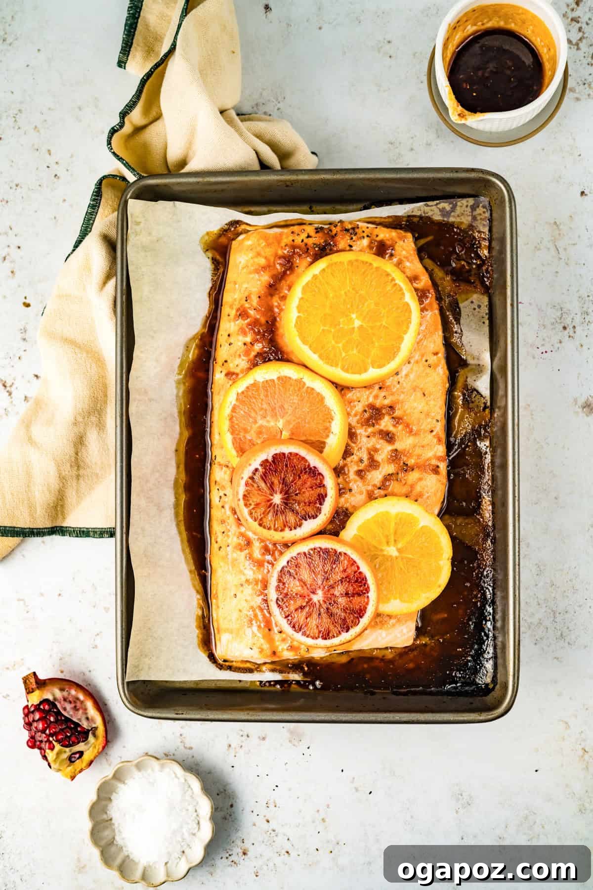 Zesty Orange Glazed Salmon 9 Orange Glazed Salmon cooked to perfection on a baking sheet.