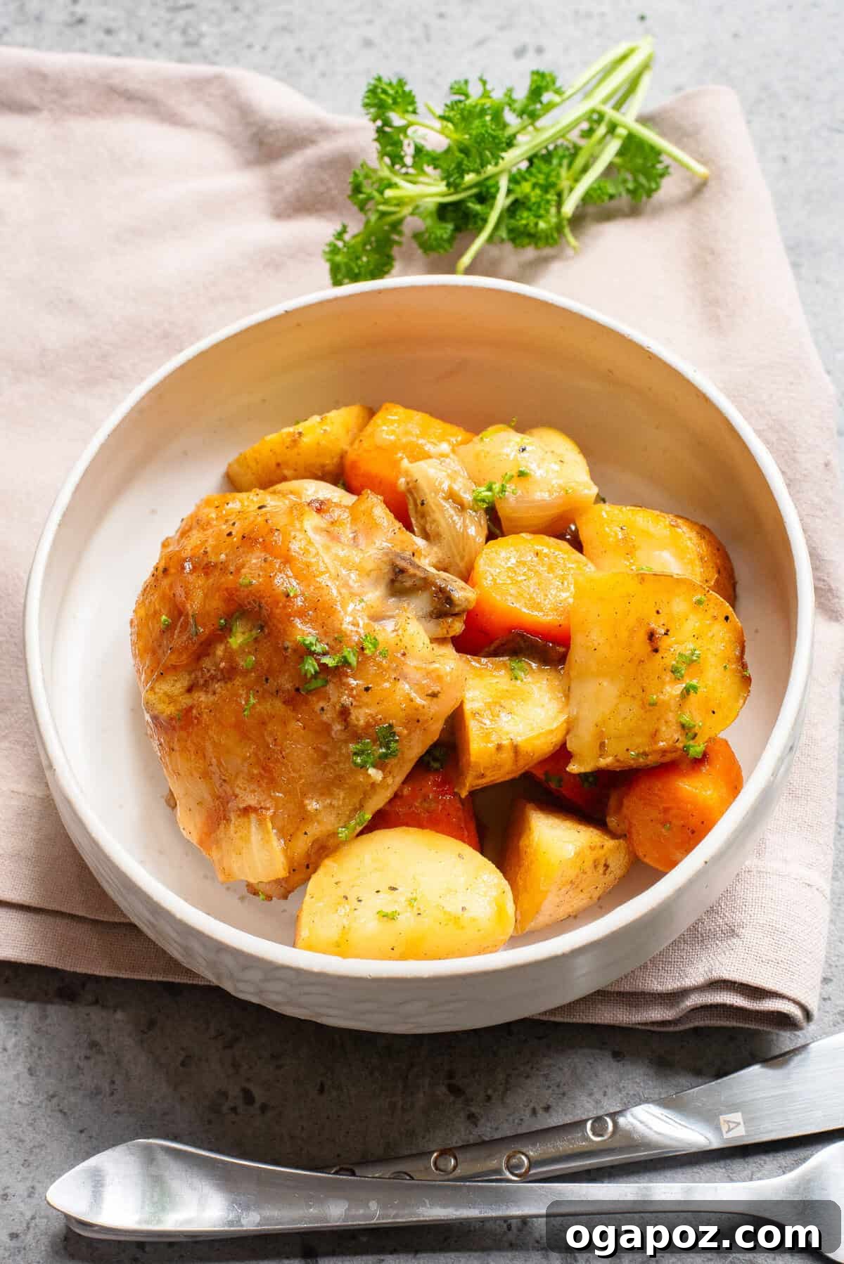 Golden Honey Mustard Sheet Pan Chicken Thighs 5 Sheet Pan Honey Mustard Chicken Thighs in a serving bowl with fresh parsley