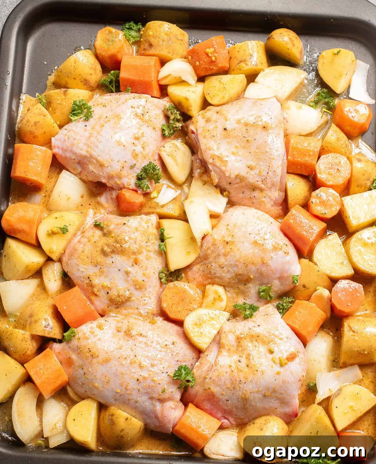 Golden Honey Mustard Sheet Pan Chicken Thighs 7 Sheet Pan Honey Mustard Chicken Thighs coated in sauce before baking